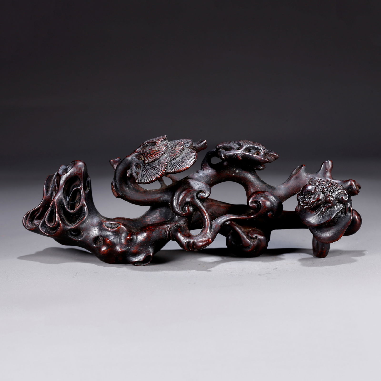 A ZITAN WOOD CARVING OF FLORAL AND PLANT MOTIF ORNAMENT: Zitan wood carving of floral and plant motif ornament