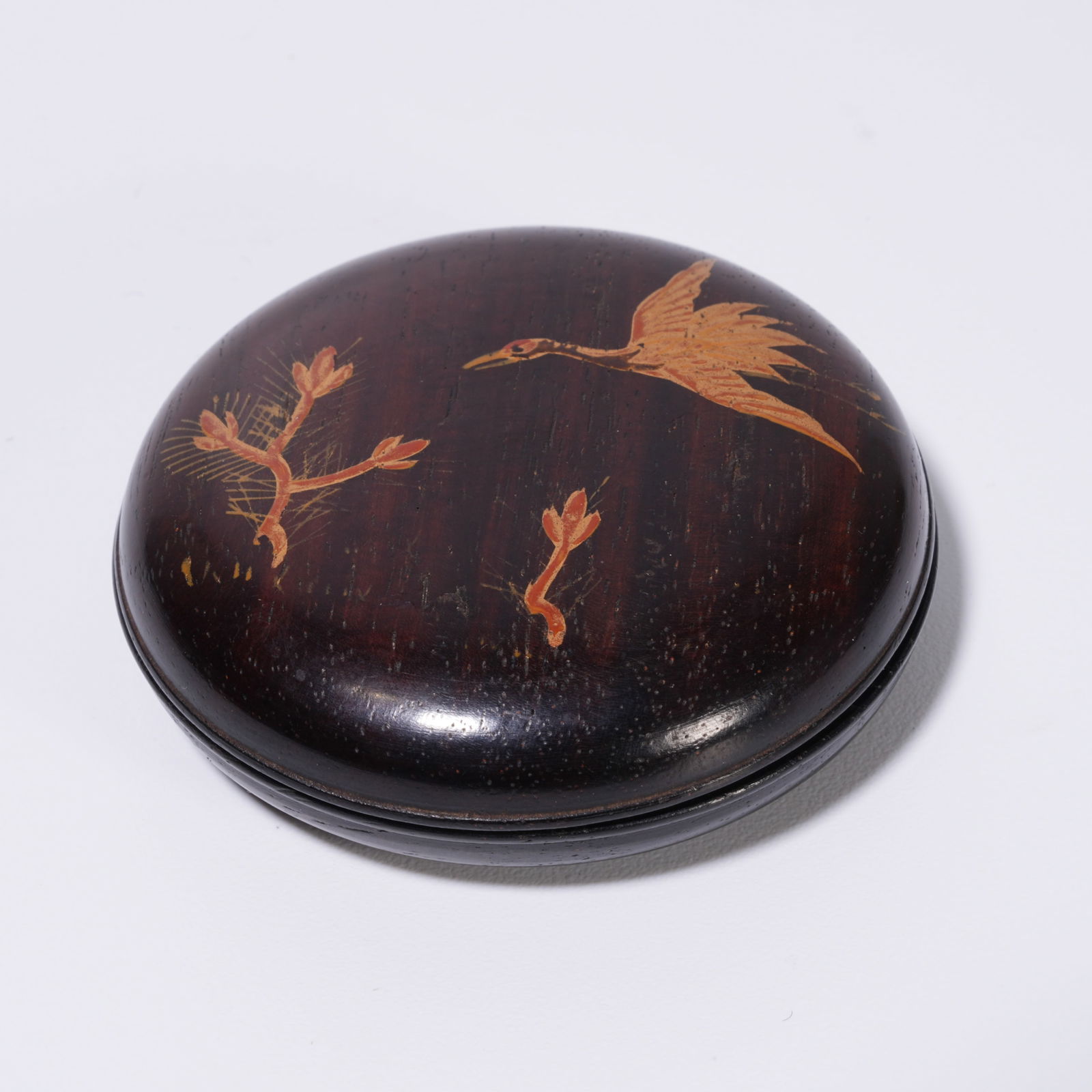 A ZITAN WOOD GILT PAINTED CRANE-PATTERN COVERED BOX: Zitan Wood Gilt Painted Crane-Pattern Covered Box