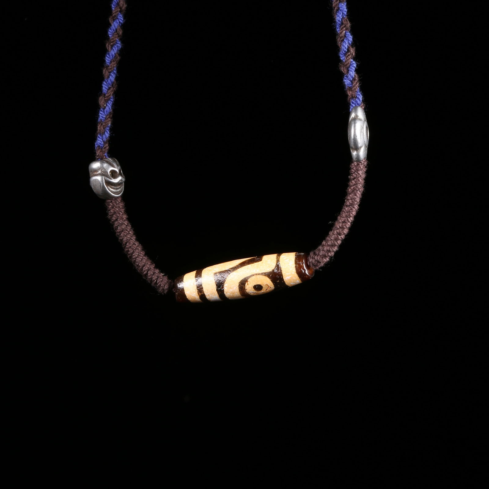 A AGATE TWO-EYED DZI BEAD: Agate Two-Eyed Dzi Bead