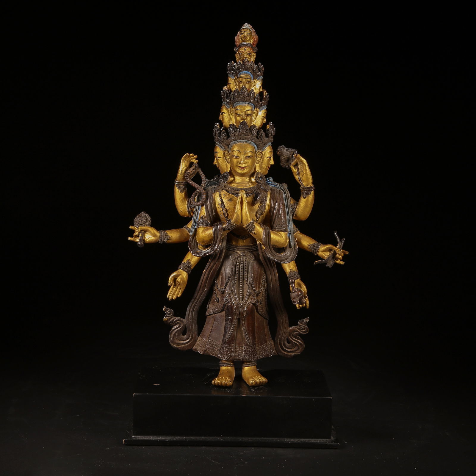 A BRONZE AND GILT ELEVEN-FACED AVALOKITESHVARA STATUE: Bronze and Gilt Eleven-Faced Avalokiteshvara Statue