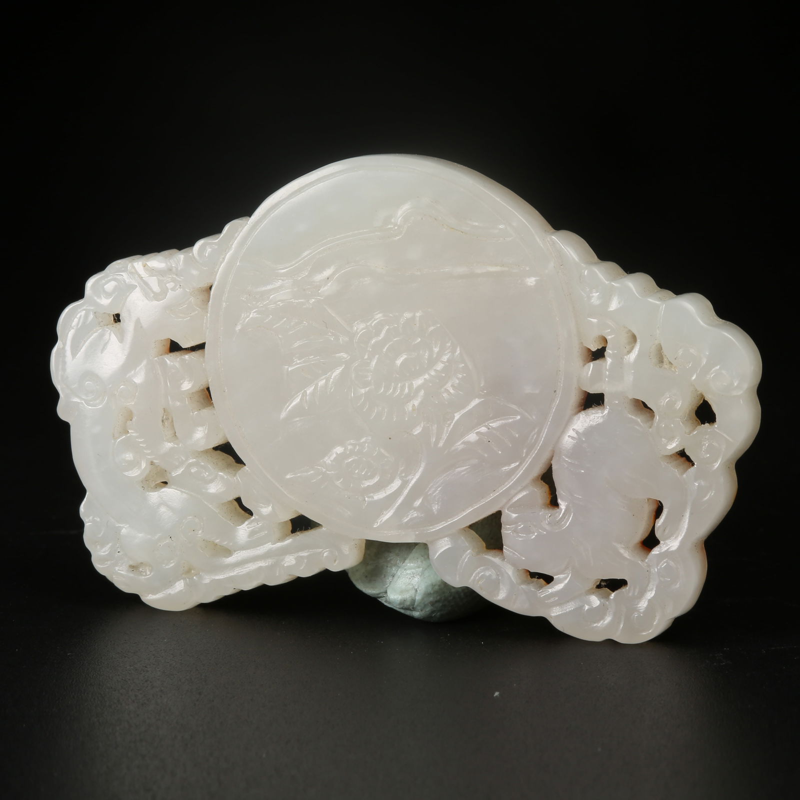 A HETIAN JADE DRAGON-AND-TIGER MOTIF PENDANT: Hetian Jade Dragon-and-Tiger Motif Pendant