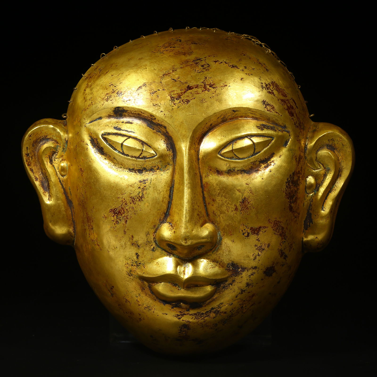 A GILT BRONZE MASK (1 of 7)