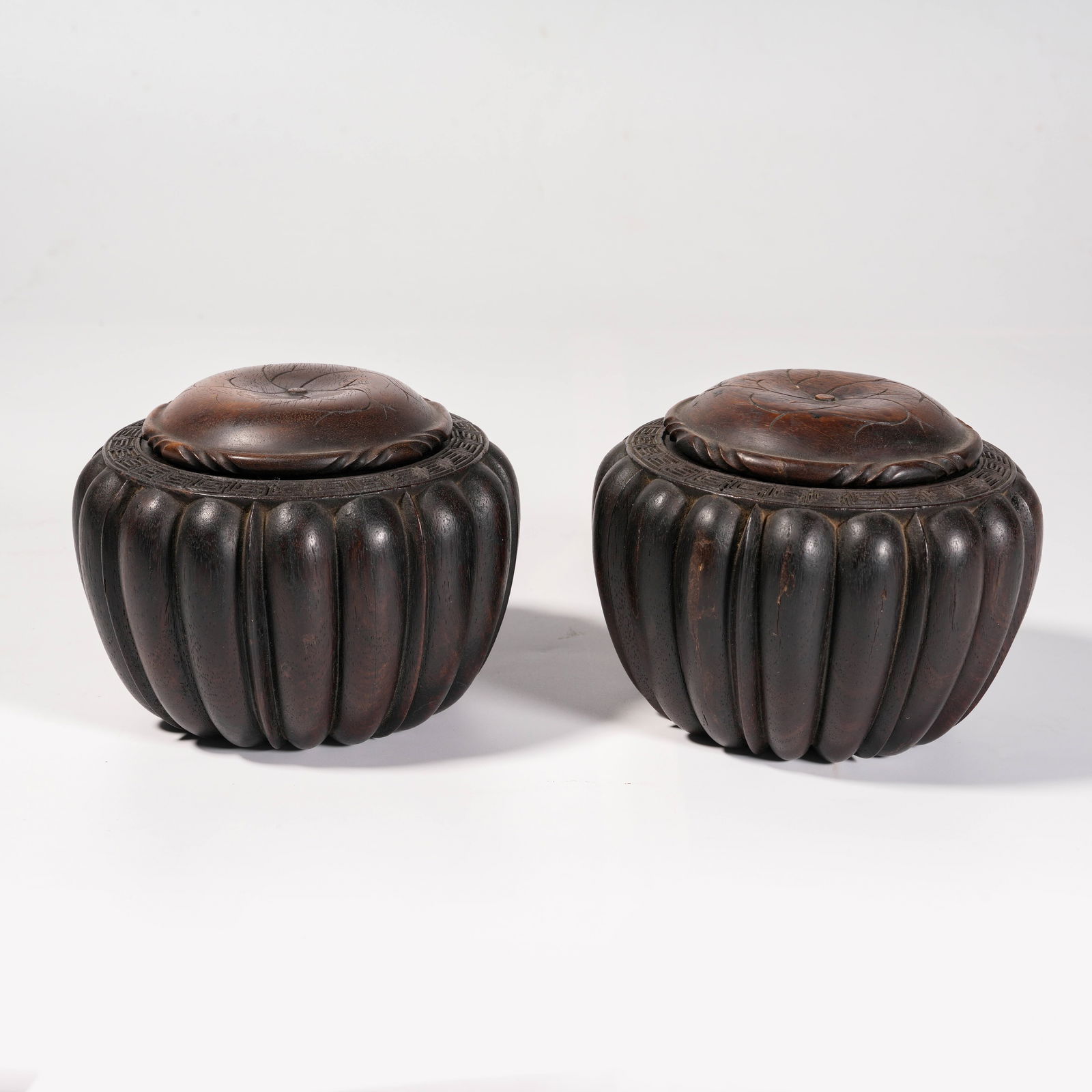 A SET OF ZITAN WOOD MELON-RIBBED GO CONTAINERS: Set of Zitan Wood Melon-Ribbed Go Containers