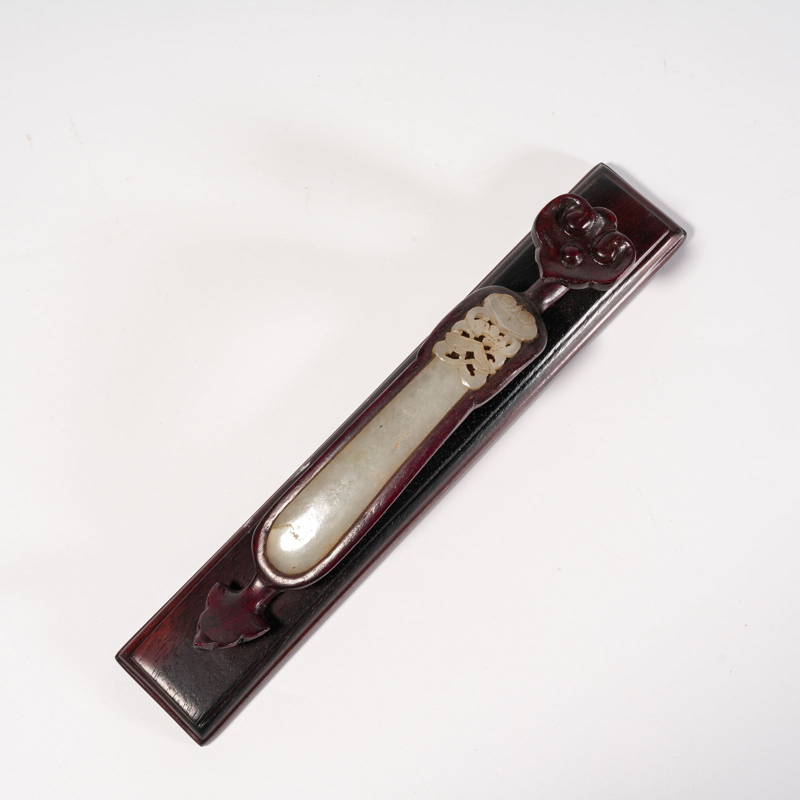 A ZITAN WOOD ORNAMENT WITH INLAID HETIAN JADE HAIRPIN: Zitan Wood Ornament with Inlaid Hetian Jade Hairpin