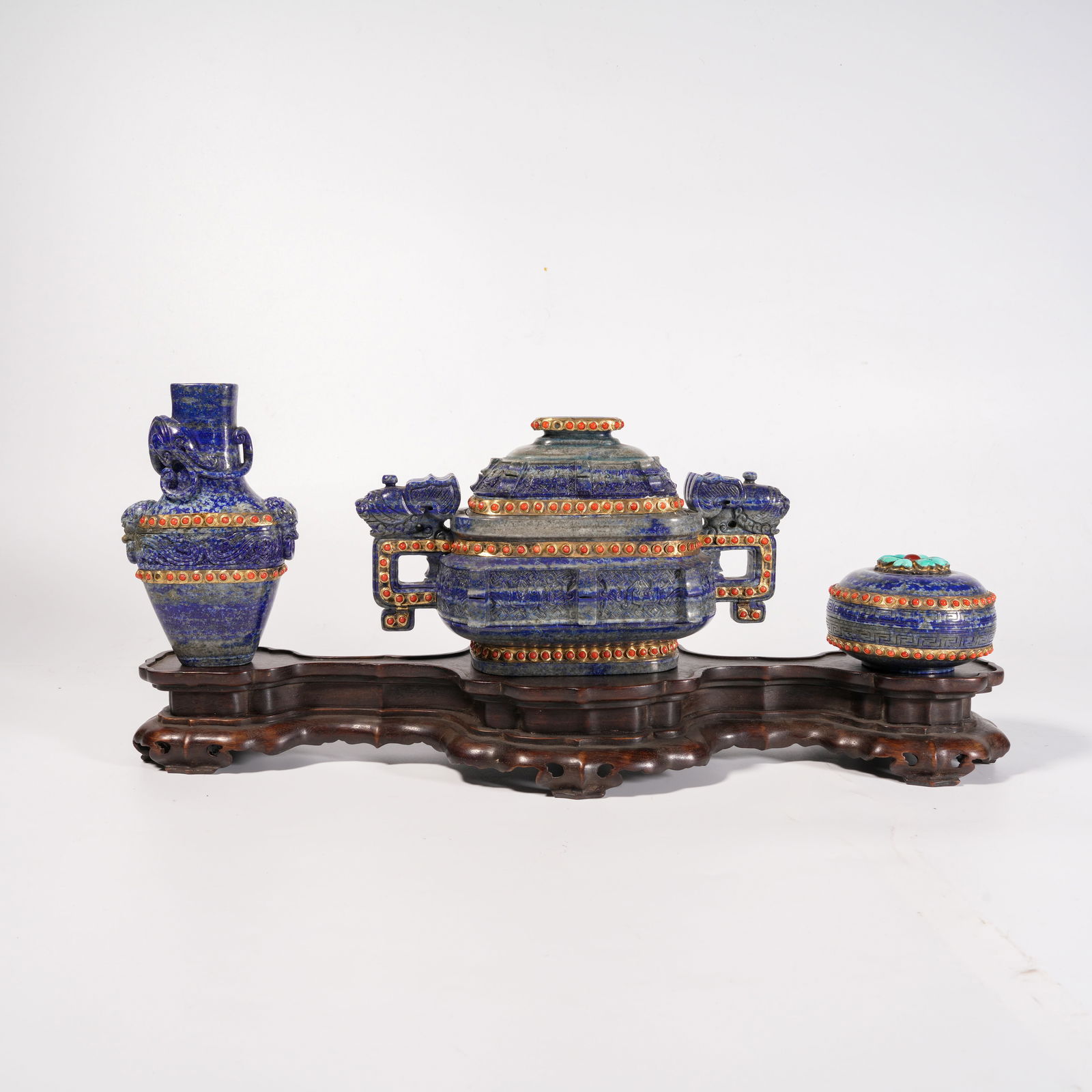 A SET OF THREE LAPIS LAZULI AND GEM-SET VASE-PEDESTAL FIGURINES: Set of Three Lapis Lazuli and Gem-Set Vase-Pedestal Figurines