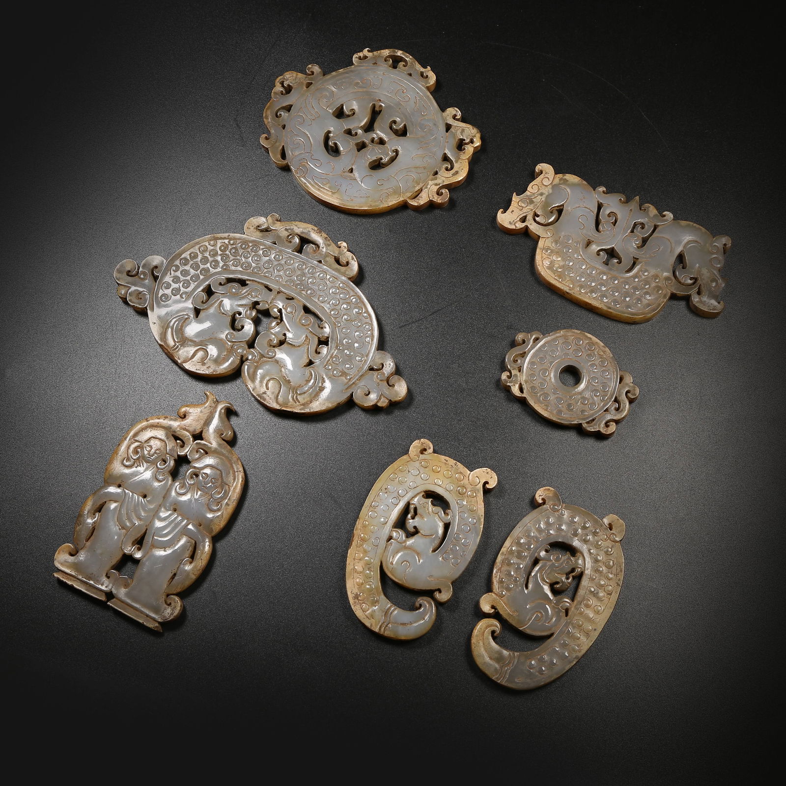 A ANCIENT JADE AUSPICIOUS BEAST PENDANT SET: Ancient Jade Auspicious Beast Pendant Set