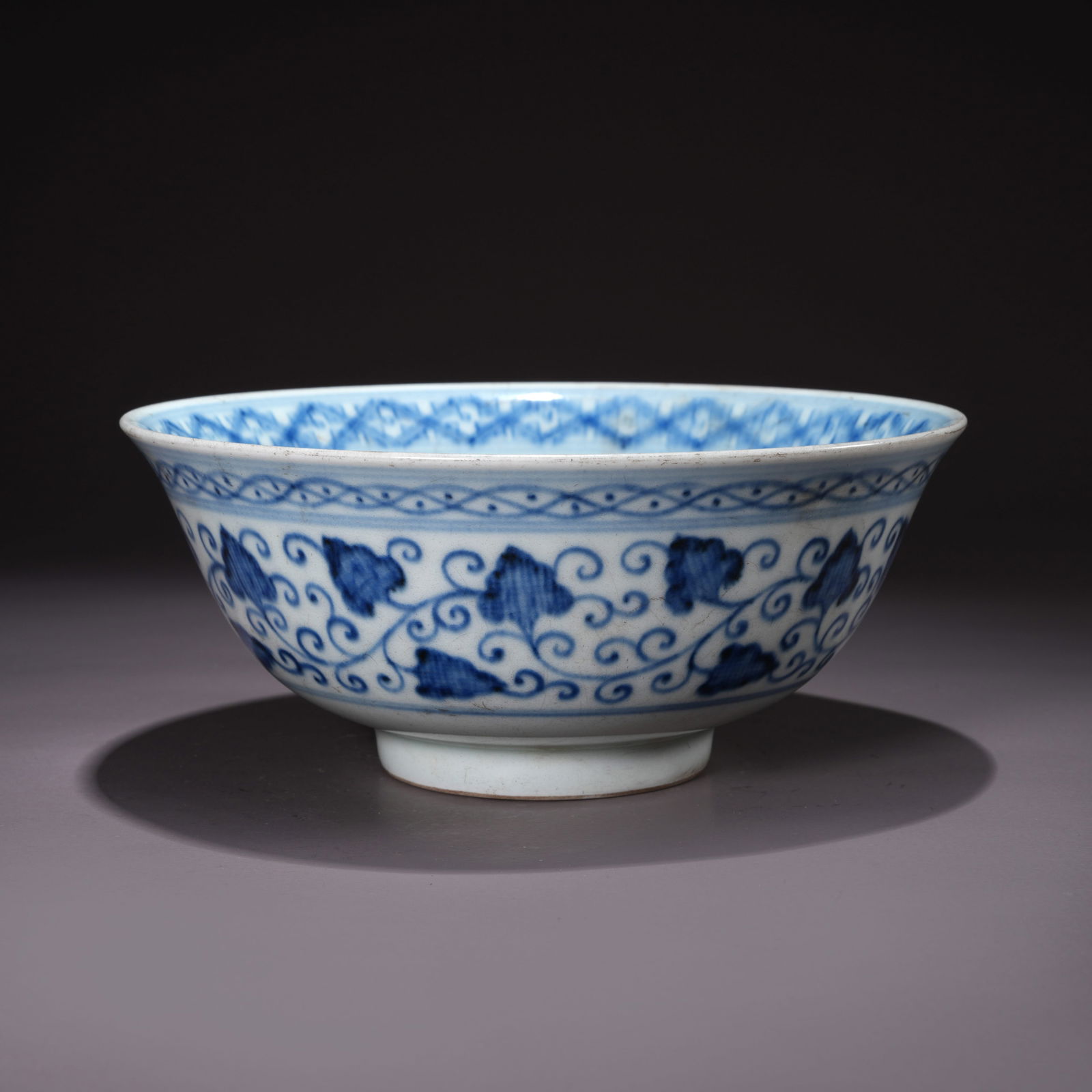 A BLUE-AND-WHITE BOWL WITH LIANHUA FLOWER MOTIFS (1 of 9)