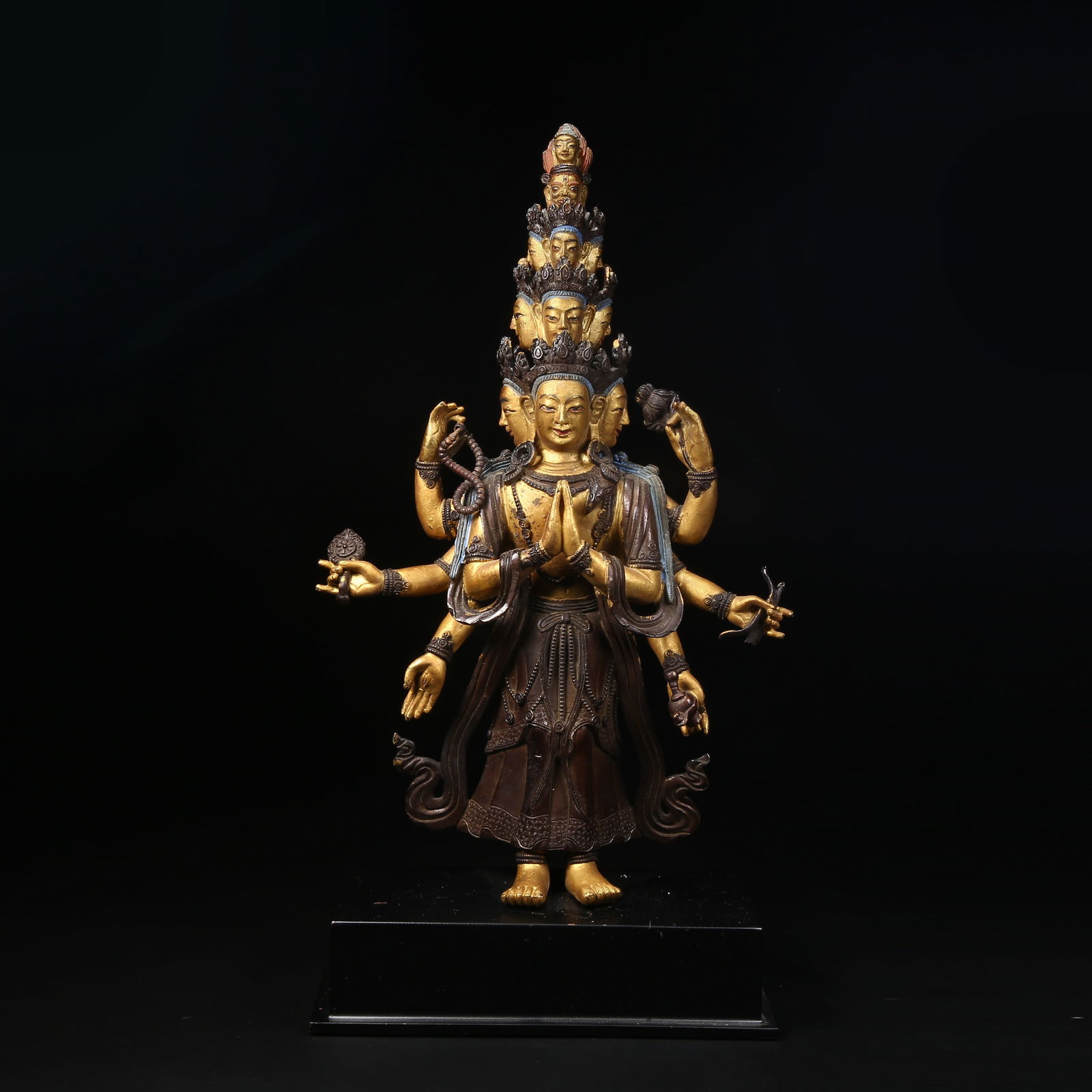 A GILT BRONZE STATUE OF ELEVEN-FACED AVALOKITESHVARA: Gilt copper statue of Eleven-faced Avalokiteshvara