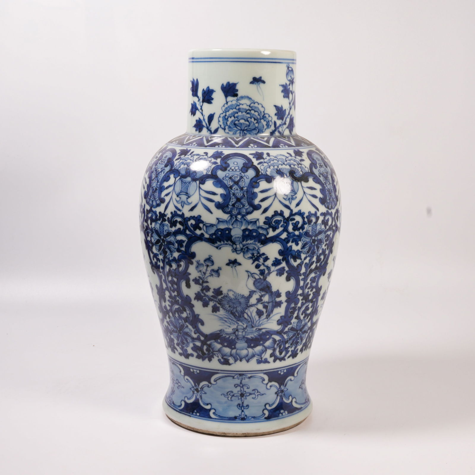 A BLUE-AND-WHITE VASE WITH FLOWER-AND-BIRD DESIGN: Blue-and-White Vase with Flower-and-Bird Design