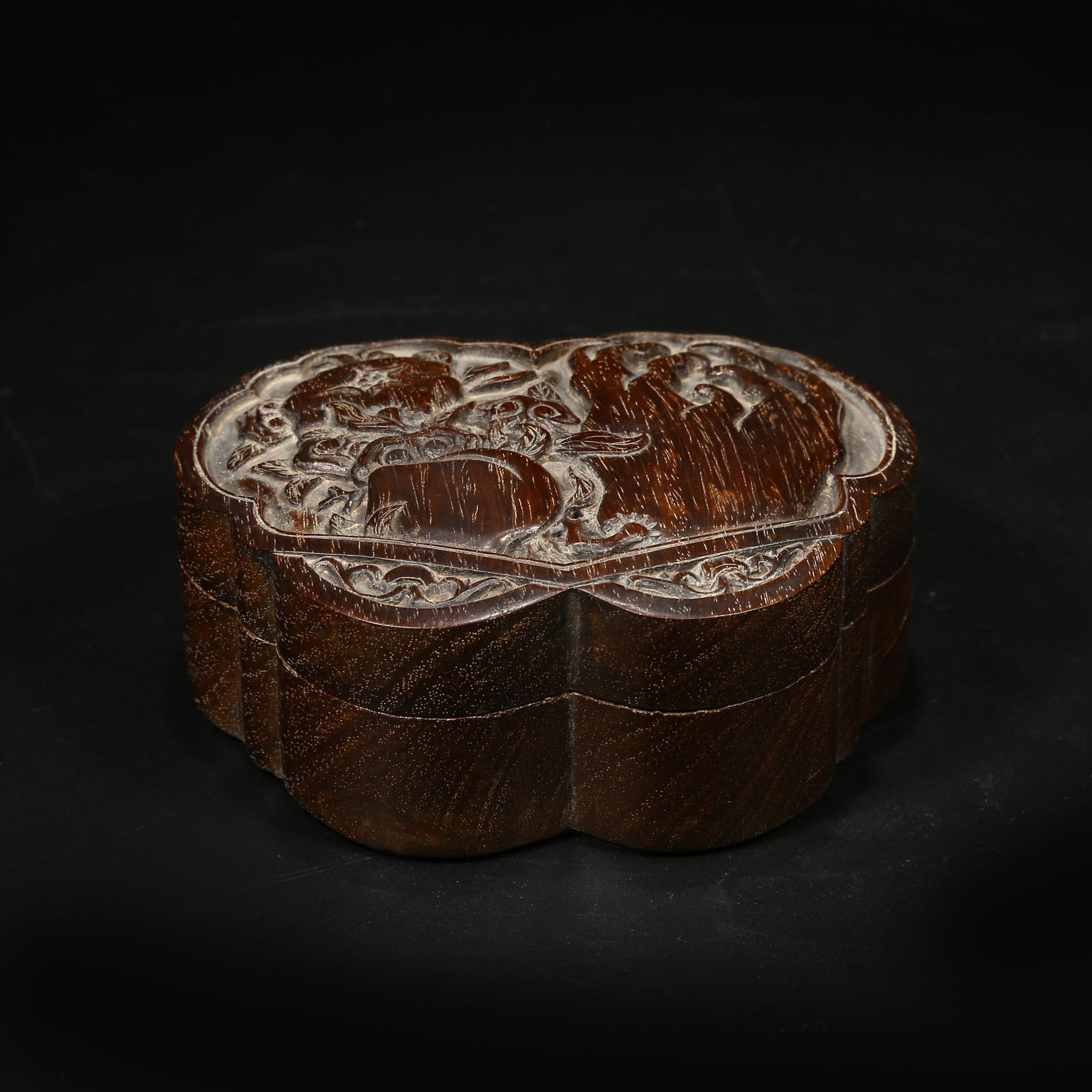 A ZITAN BOX WITH "THREE ABUNDANCES" (PEACH, POMEGRANATE, AND BUDDHA’S HAND) MOTIF: Zitan Box with "Three Abundances" (Peach, Pomegranate, and Buddha’s Hand) Motif