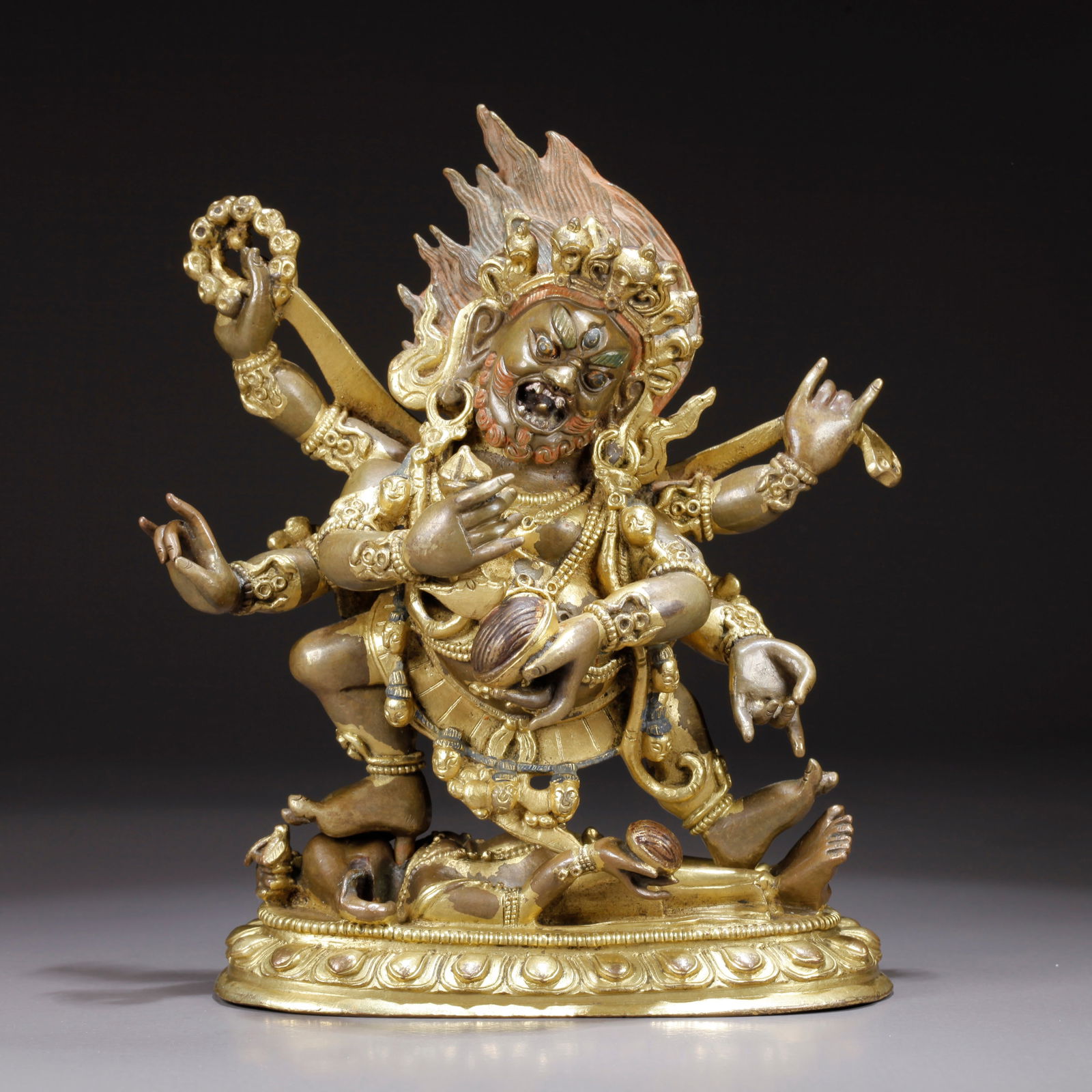 A GILDED BRONZE SIX-ARMED MAHAKALA STATUE: Gilded Bronze Six-Armed Mahakala Statue