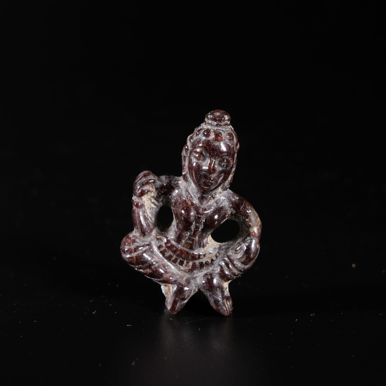 A STONE CARVED BUDDHA PENDANT: Stone Carved Buddha Pendant