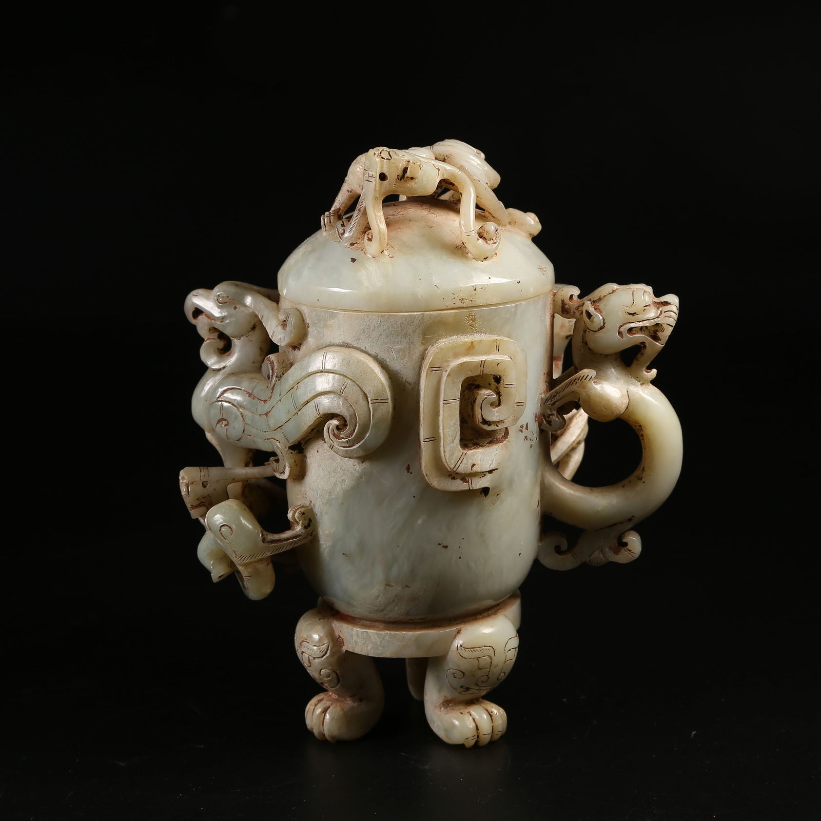 A ANCIENT JADE CARVED DRAGON AND PHOENIX THREE-LEGGED COVERED CUP: Ancient Jade Carved Dragon and Phoenix Three-Legged Covered Cup