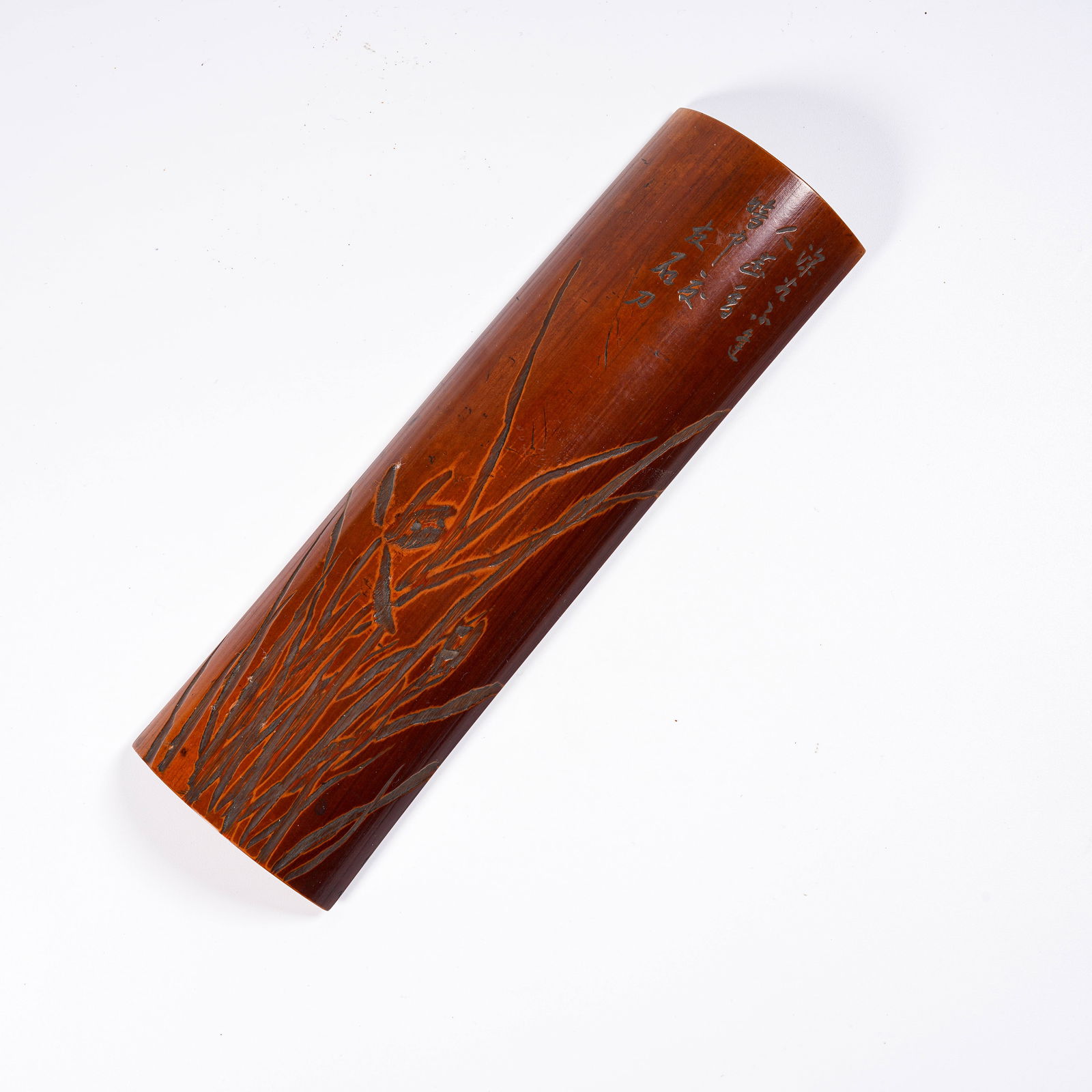 A BAMBOO CARVED PLUM BLOSSOM-PATTERN ARMREST: Bamboo Carved Plum Blossom-Pattern Armrest