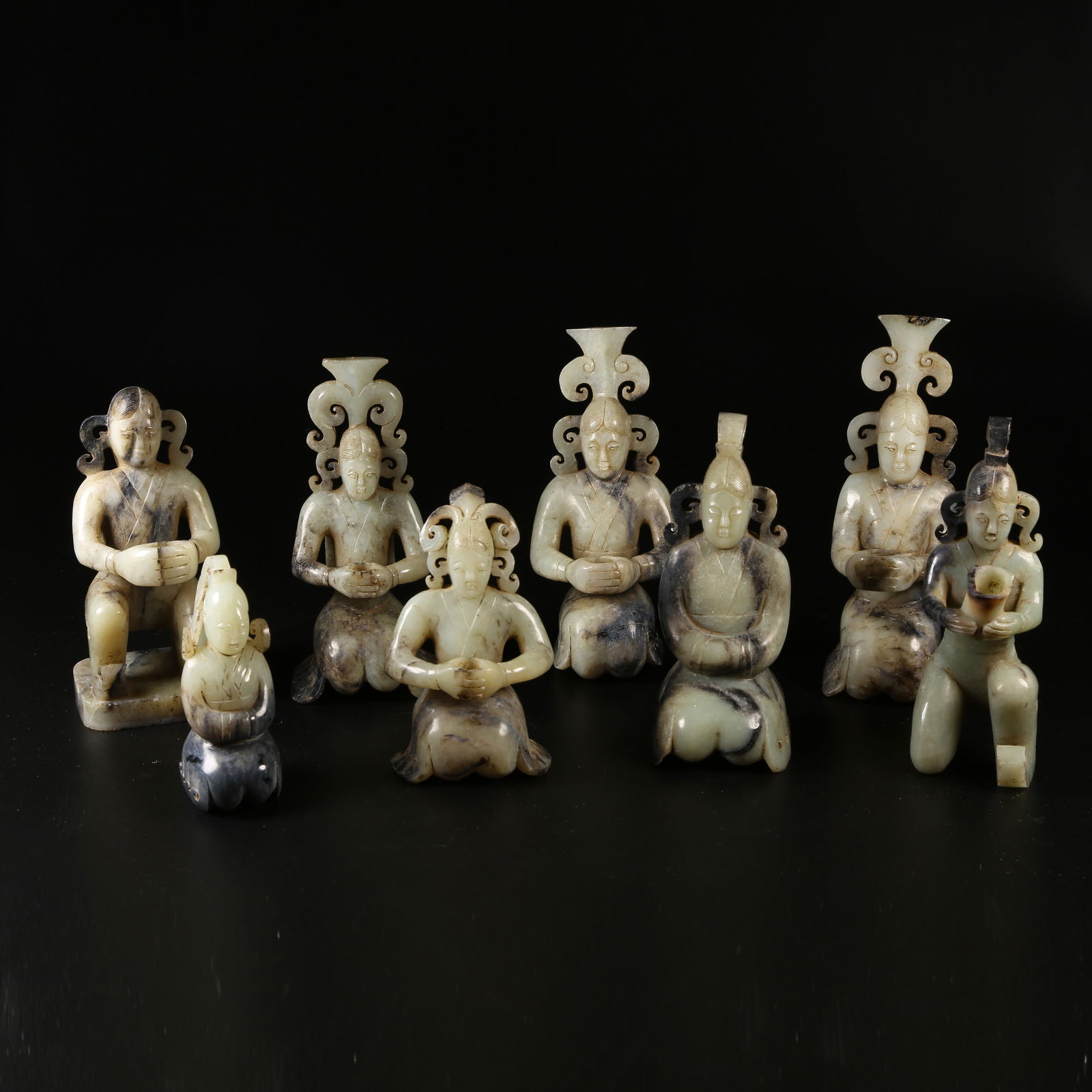 A SET OF ANCIENT JADE KNEELING FIGURE CANDLESTICKS: Set of Ancient Jade Kneeling Figure Candlesticks