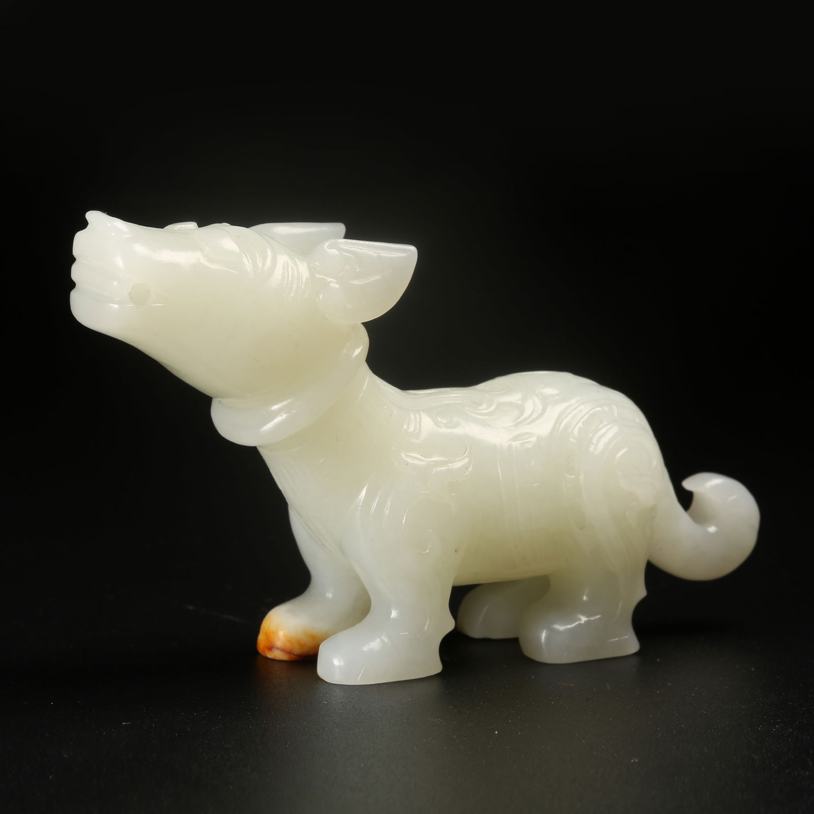 A HETIAN JADE AUSPICIOUS BEAST FIGURINE: Hetian Jade Auspicious Beast Figurine