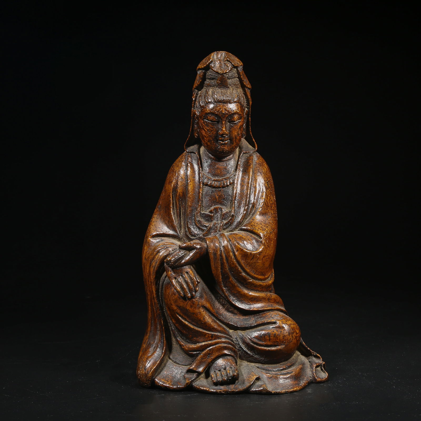 A BAMBOO ROOT CARVING OF SEATED GUANYIN HOLDING A SCROLL (1 of 8)