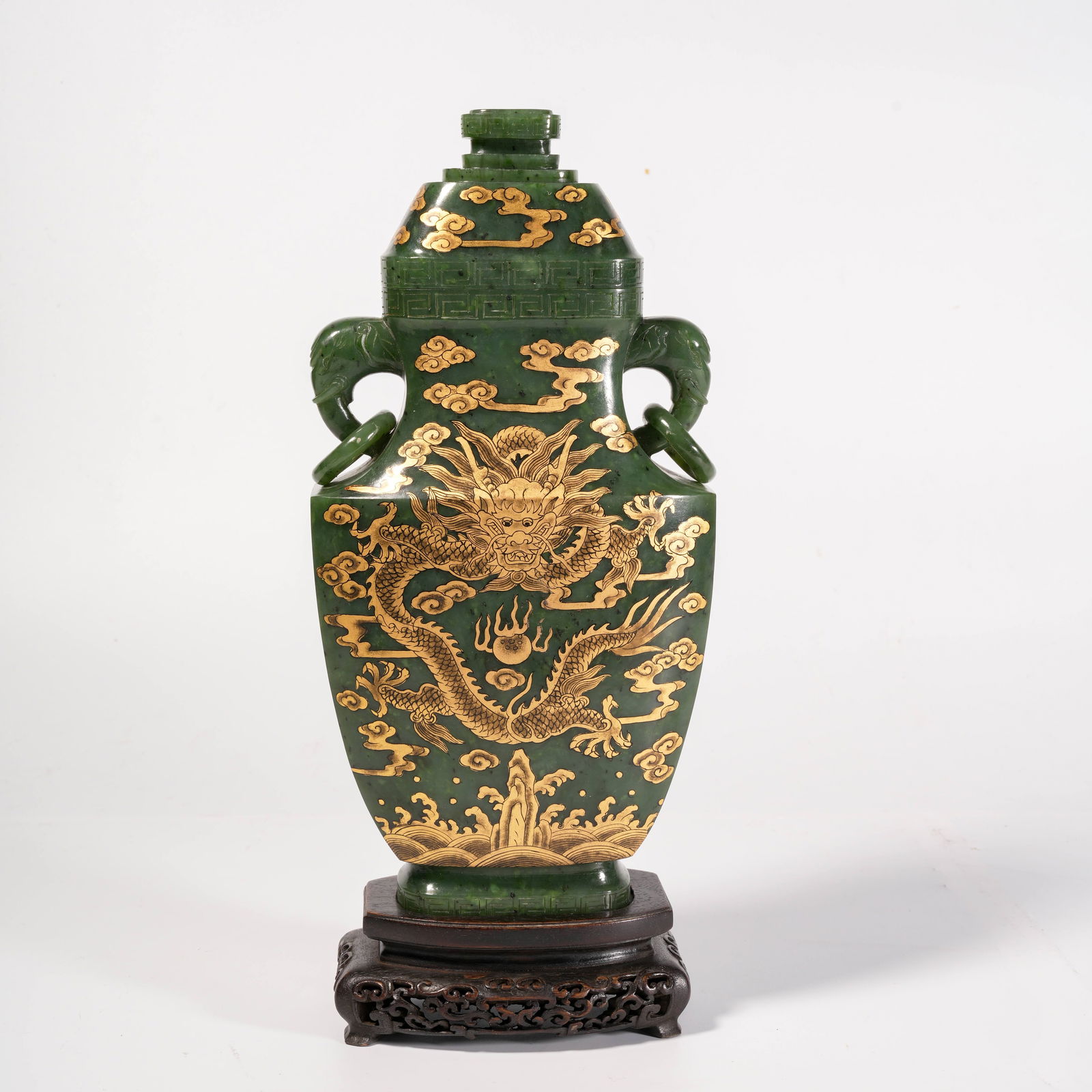 A HETIAN JADE AND GREEN JADE GILT-DECORATED VASE WITH ELEPHANT-HANDLE, RIVER CLIFF AND SEA DRAGON (1 of 10)