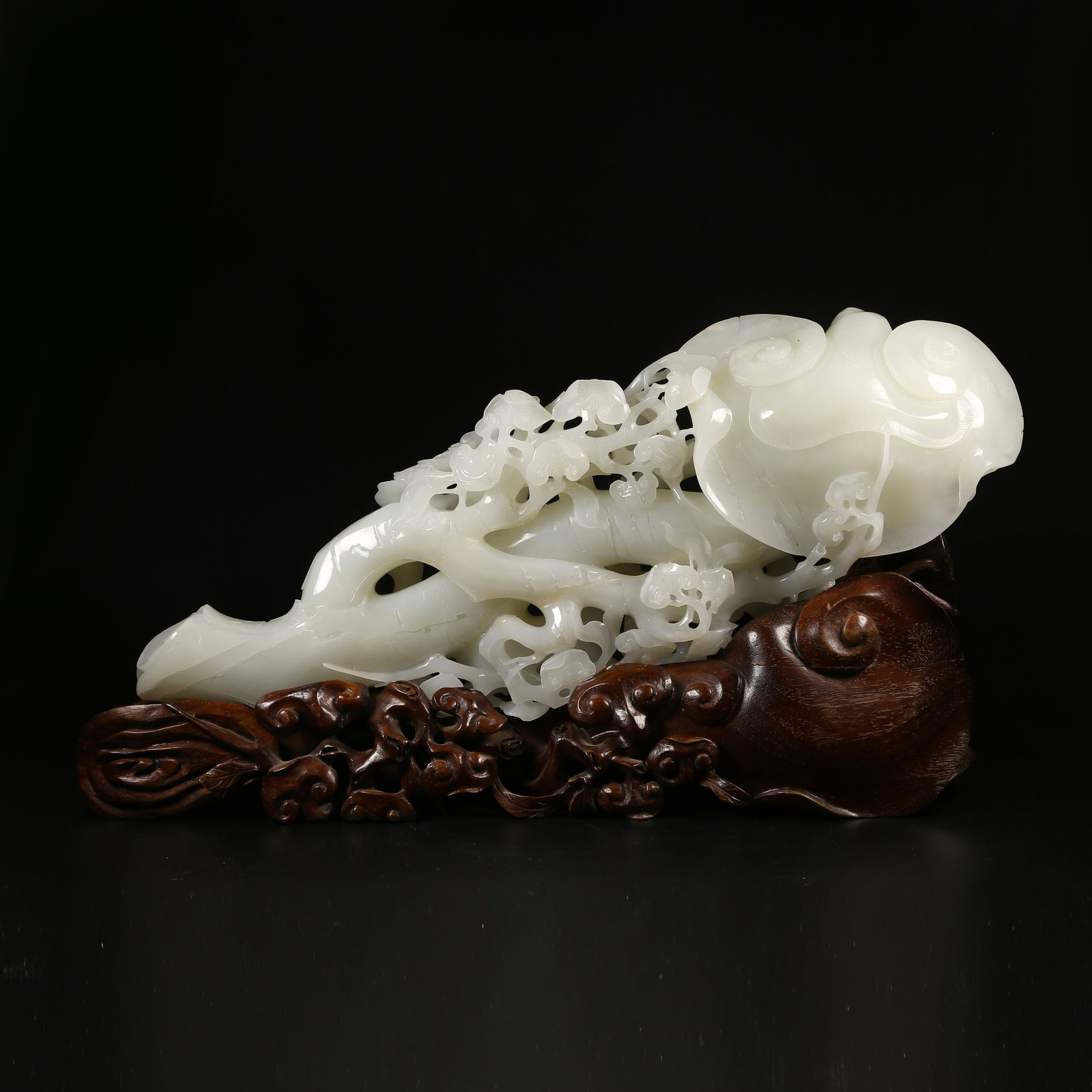 A HETIAN WHITE JADE RUYI-SHAPED MOUNTAIN-FORM ORNAMENT (1 of 9)
