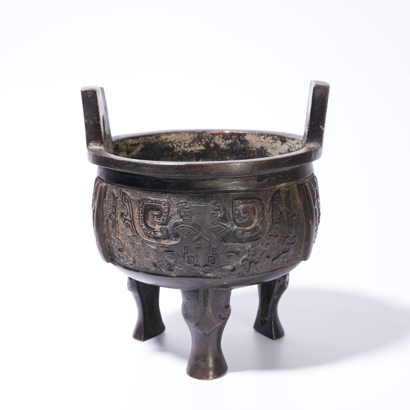 A BRONZE ANIMAL MASK-PATTERN HIGH-HANDLED CENSER: Bronze Animal Mask-Pattern High-Handled Censer