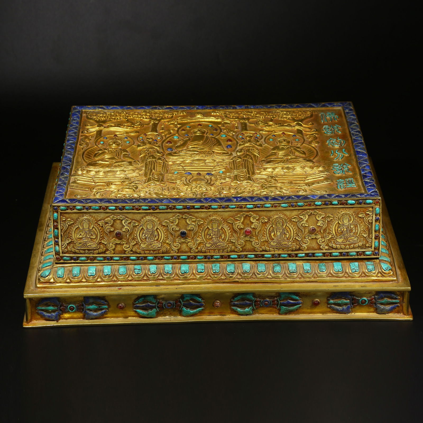 A GILT BRONZE SCRIPTURE BOX: Gilt bronze scripture box