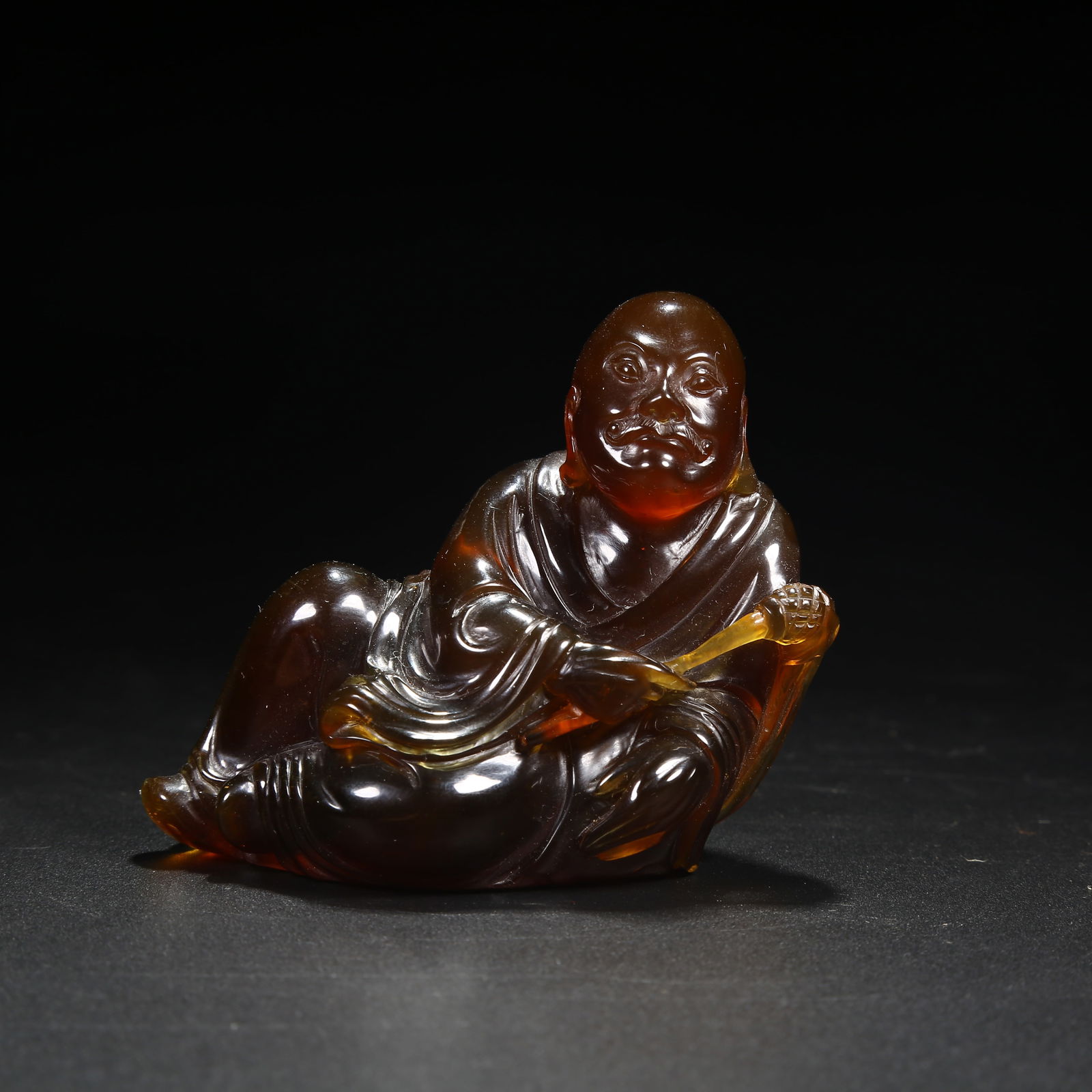 A AMBER ARHAT FIGURINE: Amber Arhat Figurine