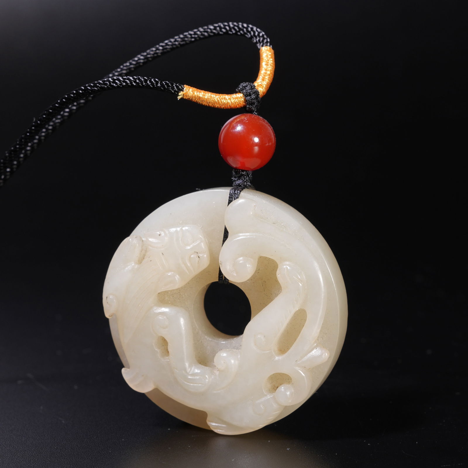 A HETIAN JADE CARVED DRAGON-PATTERN BI: Hetian Jade Carved Dragon-Pattern Bi