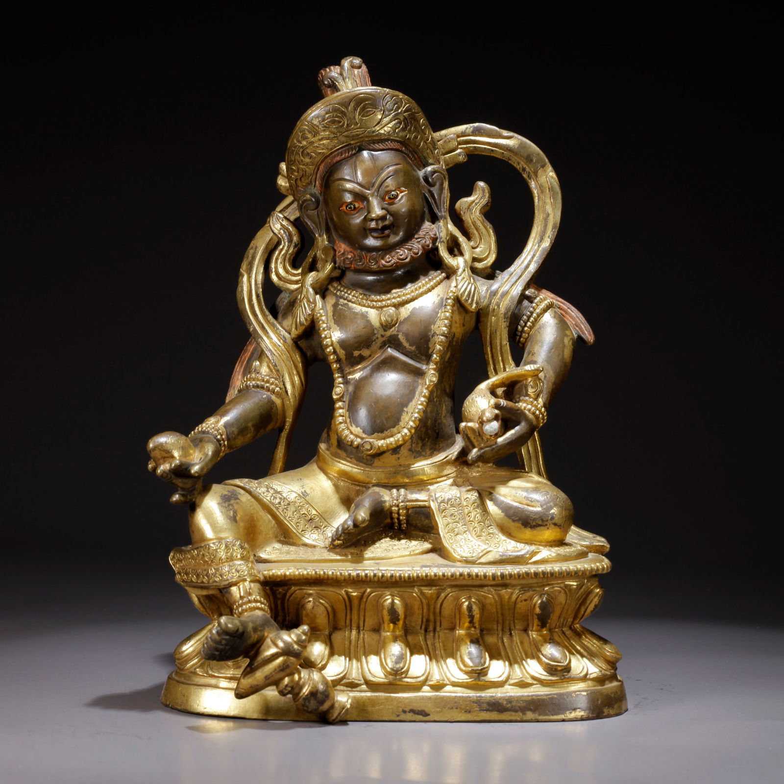 A GILDED BRONZE YELLOW WEALTH GOD STATUE (1 of 9)