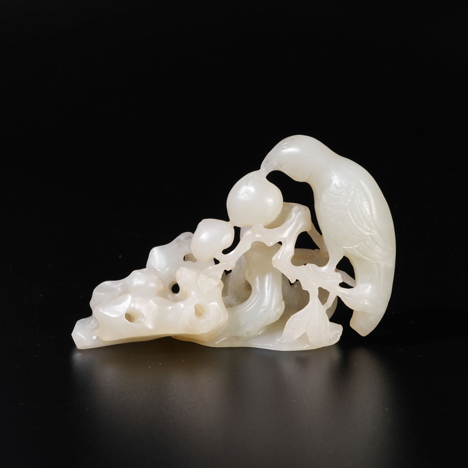 A HETIAN JADE CARVED MOUNTAIN BIRD-SHAPED ORNAMENT (1 of 9)