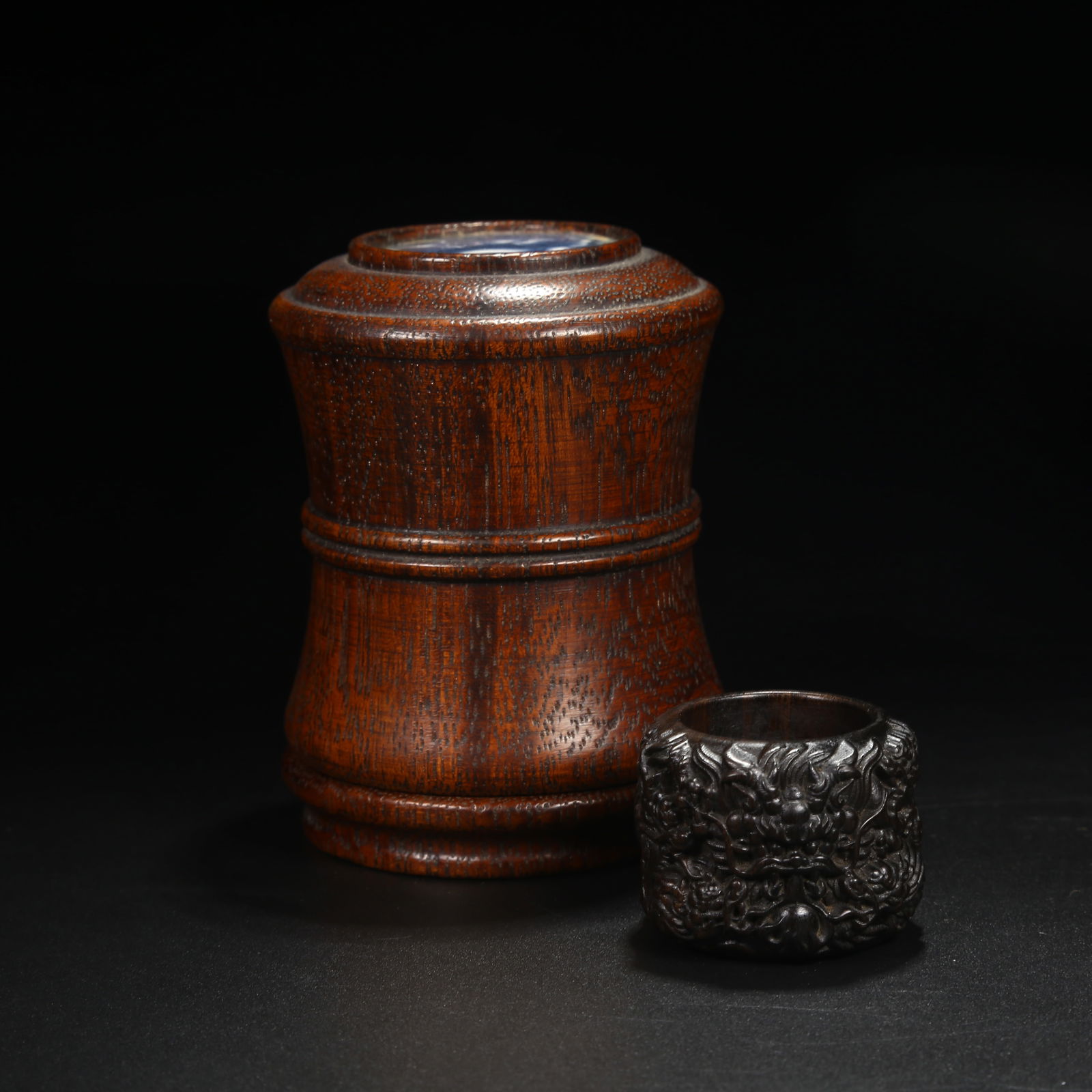 A ZITAN THUMB RING WITH NINE DRAGONS MOTIF AND MATCHING BOX: Zitan Thumb Ring with Nine Dragons Motif and Matching Box