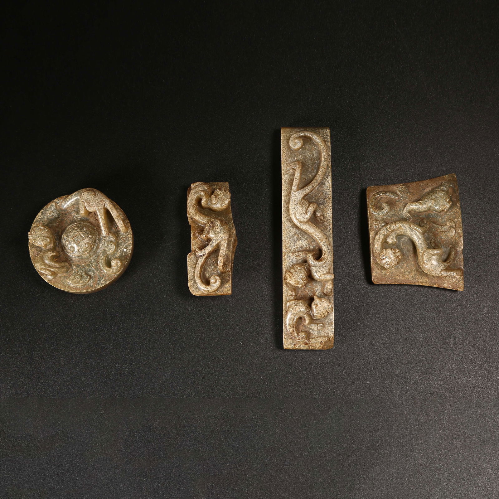 A ARCHAIC JADE CHILONG-MOTIF SWORD ORNAMENT SET: Archaic Jade Chilong-Motif Sword Ornament Set