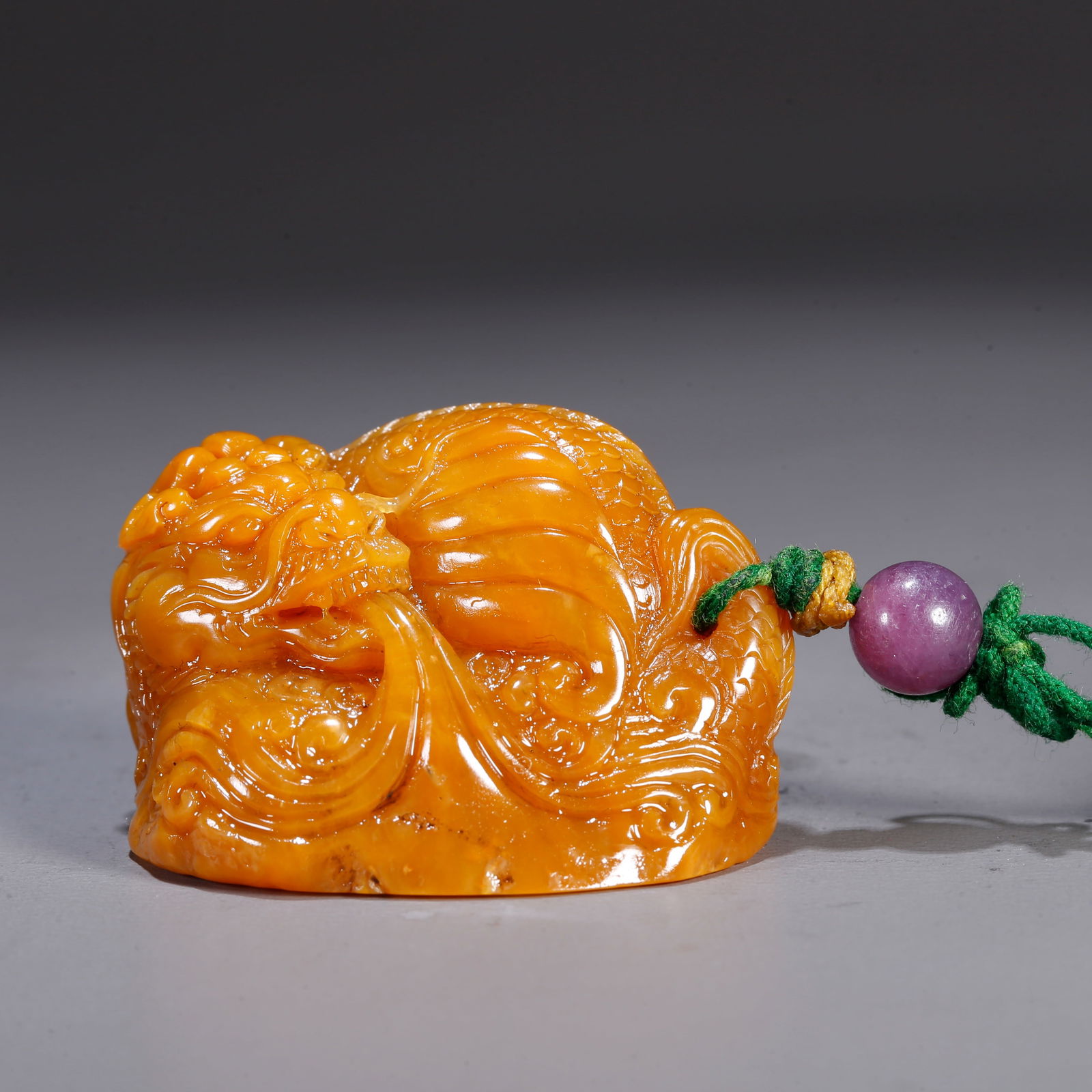 A SHOUSHAN TIANHUANG STONE CARVED AUSPICIOUS BEAST-SHAPED PENDANT: Shoushan Tianhuang stone carved auspicious beast-shaped pendant