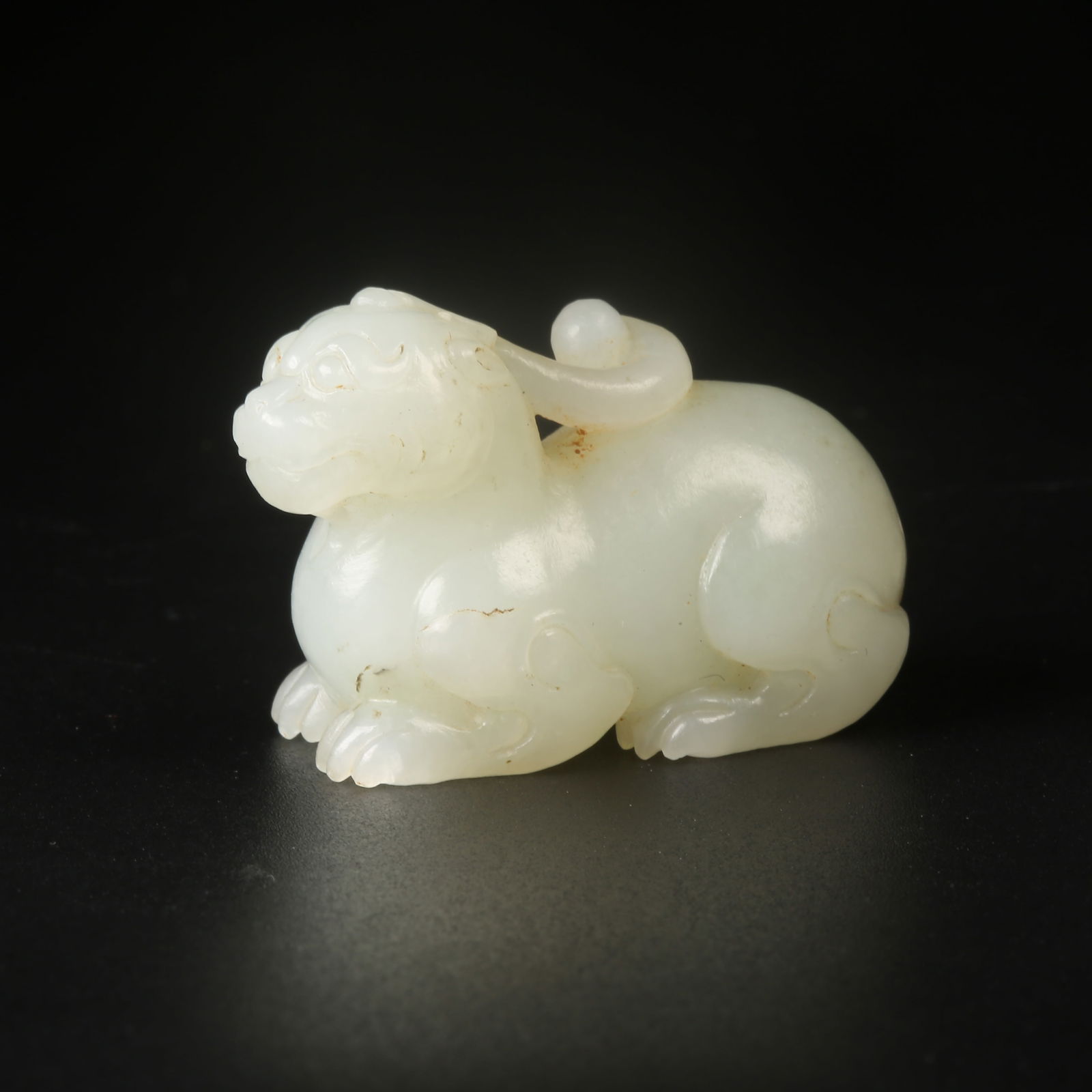 A HETIAN JADE AUSPICIOUS BEAST FIGURINE (1 of 8)