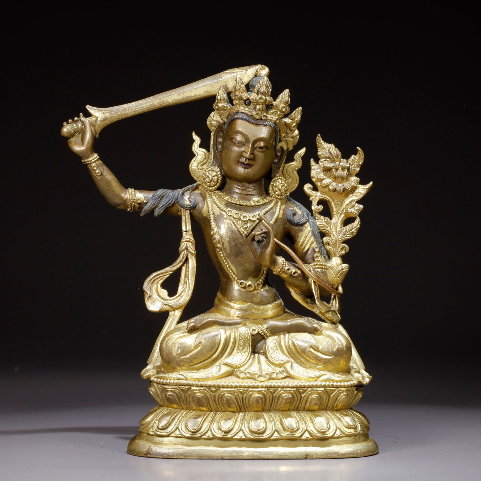 A GILDED BRONZE MANJUSHRI BODHISATTVA STATUE: Gilded Bronze Manjushri Bodhisattva Statue