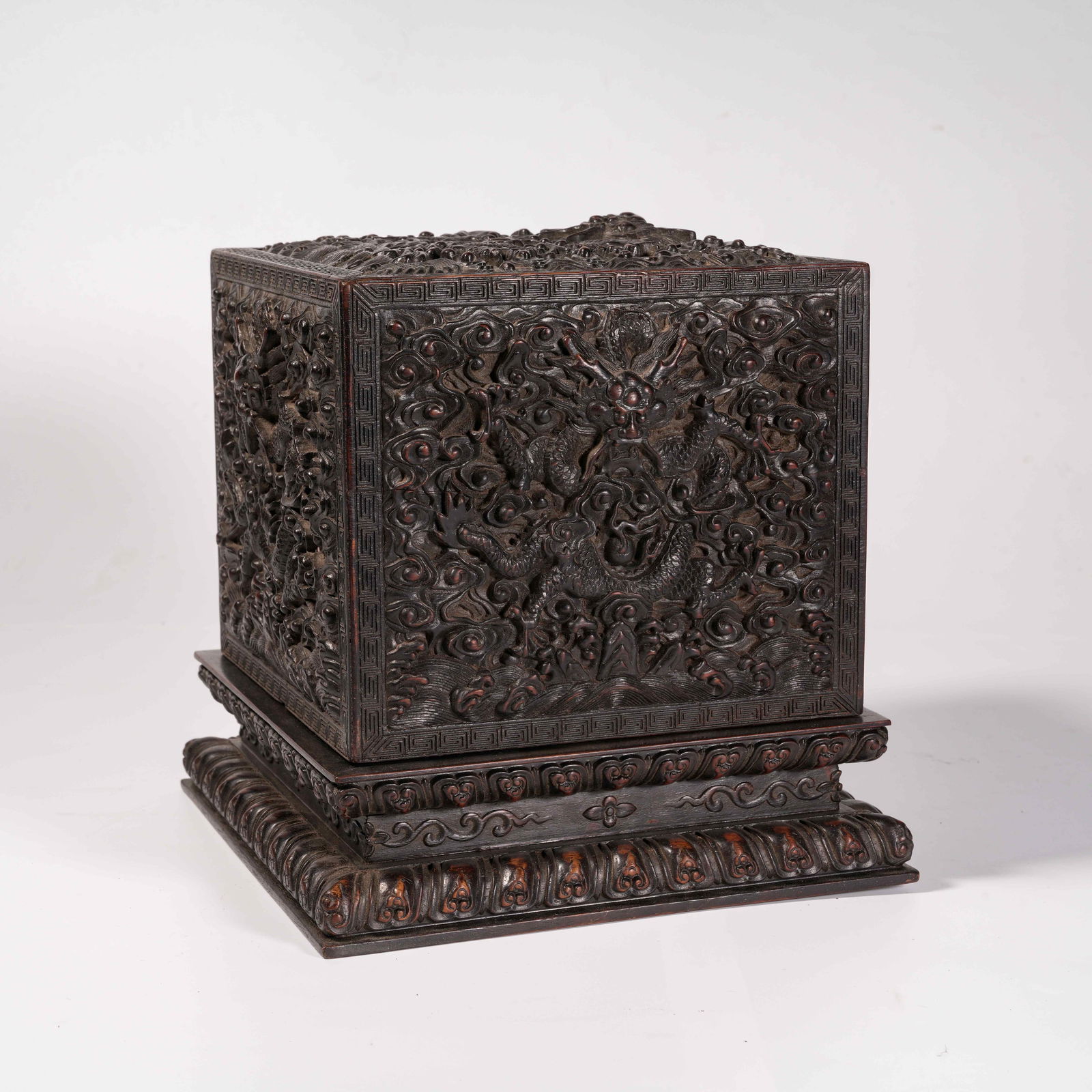 A ZITAN WOOD SQUARE COVERED BOX WITH CLOUD AND DRAGON MOTIFS: Zitan Wood Square Covered Box with Cloud and Dragon Motifs