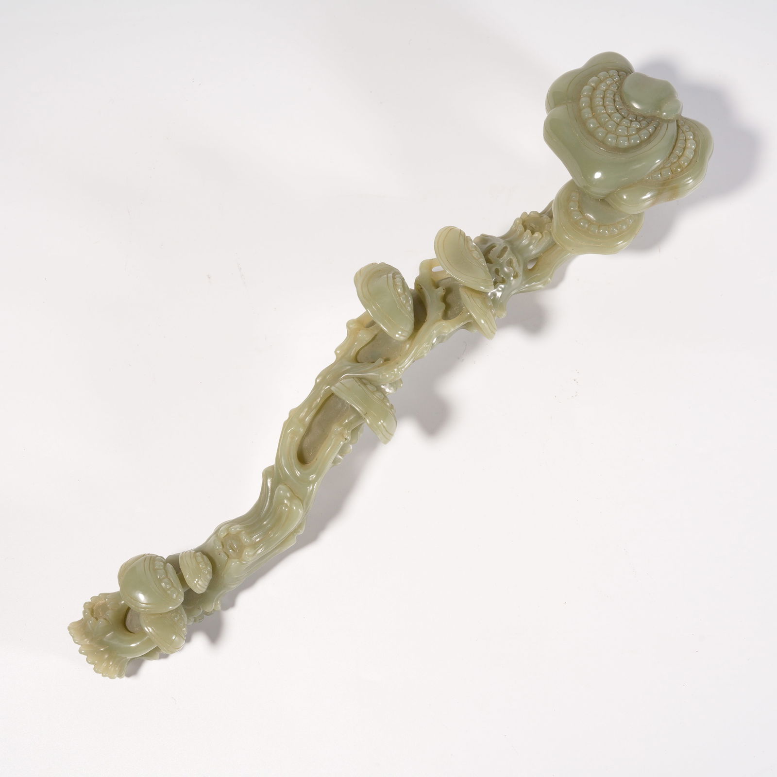 A HETIAN JADE RUYI CARVED IN LINGZHI SHAPE (1 of 7)
