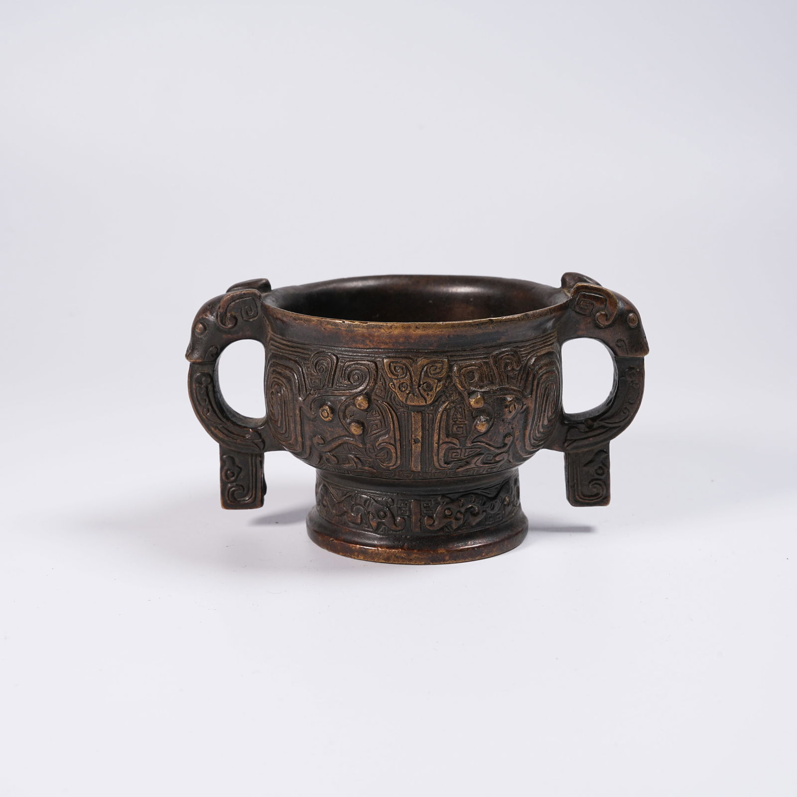 A BRONZE ANIMAL MASK-PATTERN AND ANIMAL-EARED GUI: Bronze Animal Mask-Pattern and Animal-Eared Gui