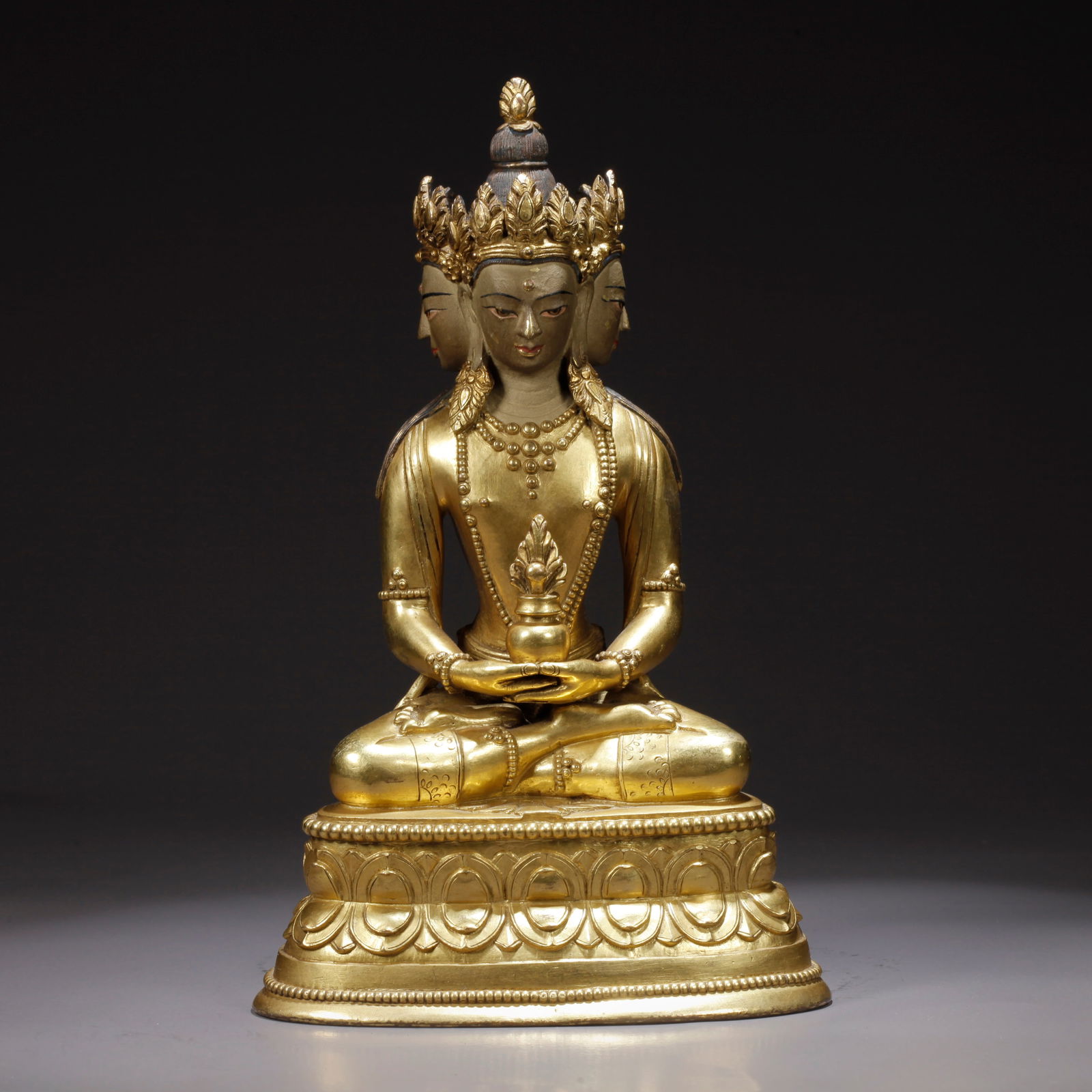 A GILDED BRONZE MEDICINE BUDDHA STATUE: Gilded Bronze Medicine Buddha Statue