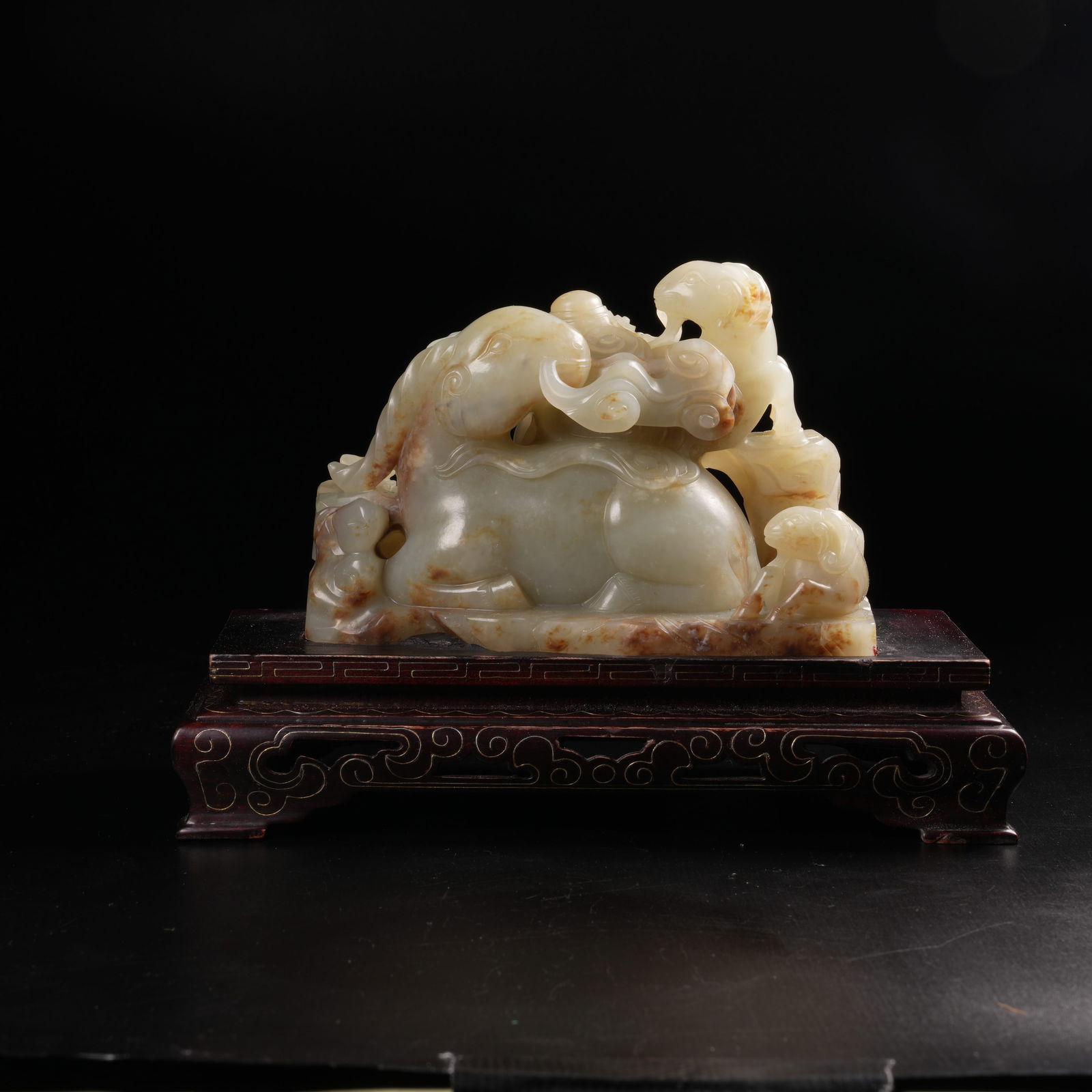 A HETIAN JADE SANYANG KAITAI FIGURE: Hetian jade Sanyang Kaitai figure