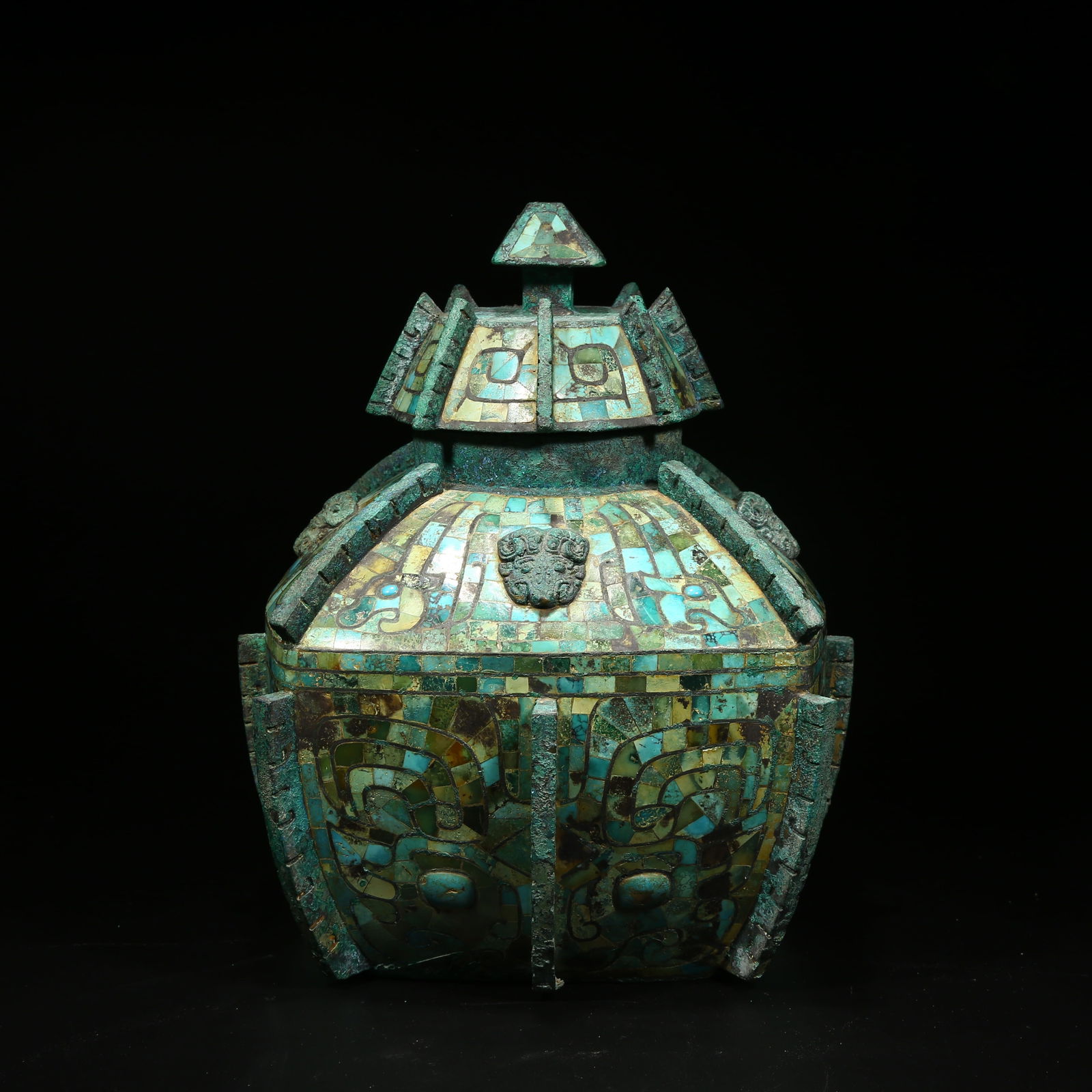 A BRONZE LEI VESSEL INLAID WITH TURQUOISE: Bronze lei vessel inlaid with turquoise