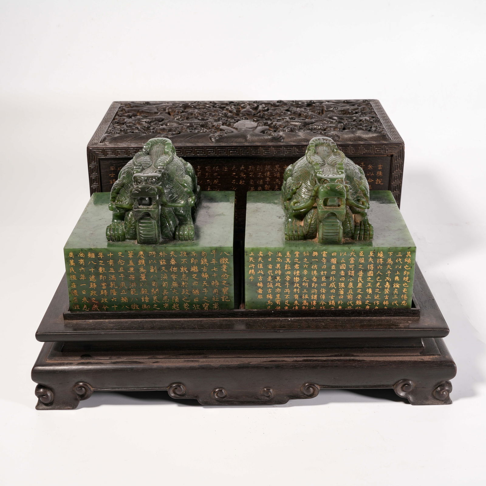 A SET OF HETIAN GREEN JADE DRAGON-HEAD SEALS (WITH ZITAN WOOD COVER BOX WITH CLOUD AND DRAGON MOTIF): Set of Hetian Green Jade Dragon-Head Seals (with Zitan Wood Cover Box with Cloud and Dragon Motif)