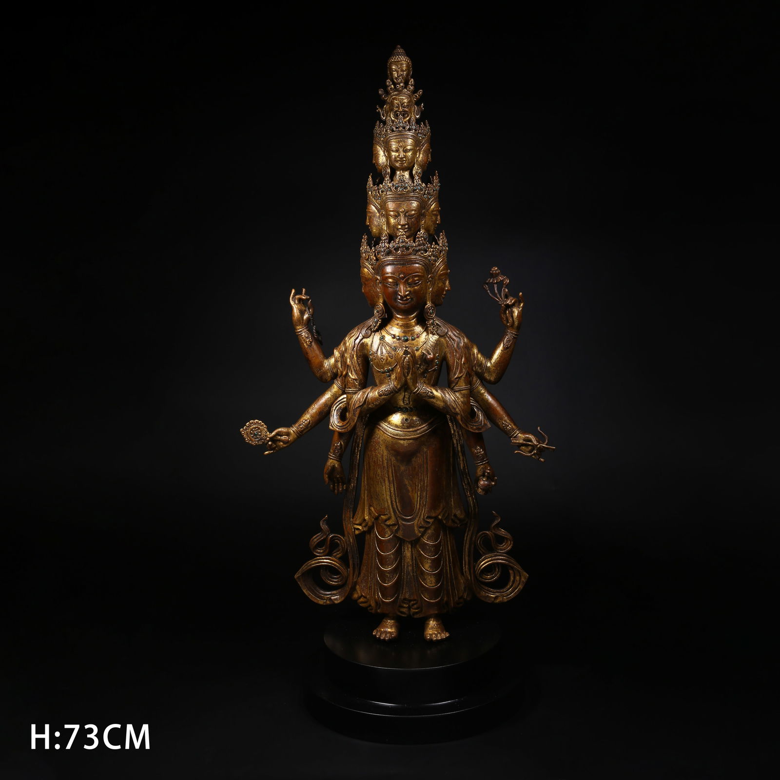 A GILT BRONZE STANDING STATUE OF ELEVEN-FACED AVALOKITESHVARA: Gilt copper standing statue of Eleven-faced Avalokiteshvara