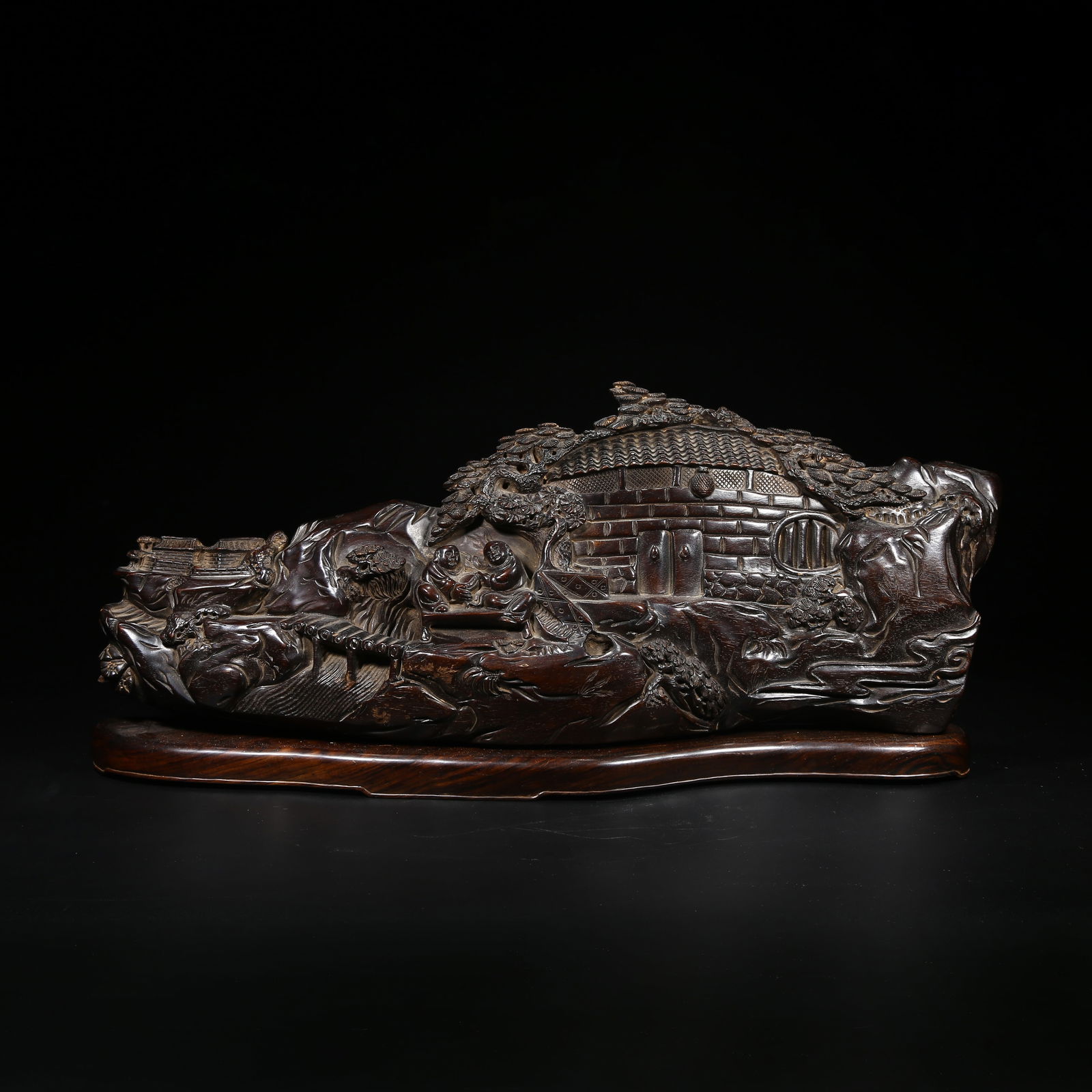 A ZITAN ROSEWOOD MOUNTAIN-SHAPED SCULPTURE WITH FIGURE STORY DESIGN: Zitan rosewood mountain-shaped sculpture with figure story design