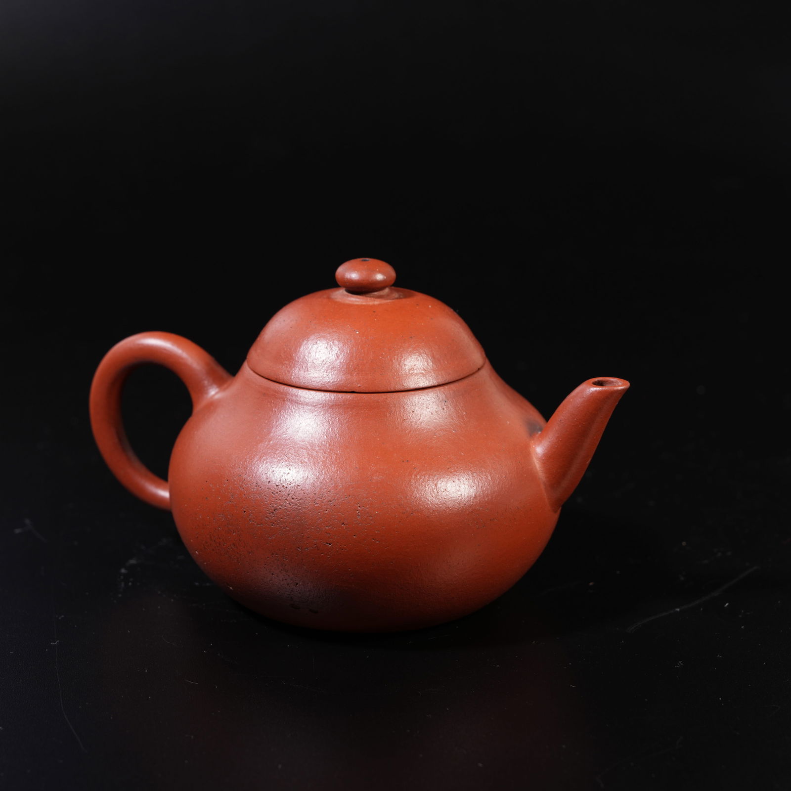 A PURPLE SAND CARVED TEAPOT: Purple Sand Carved Teapot