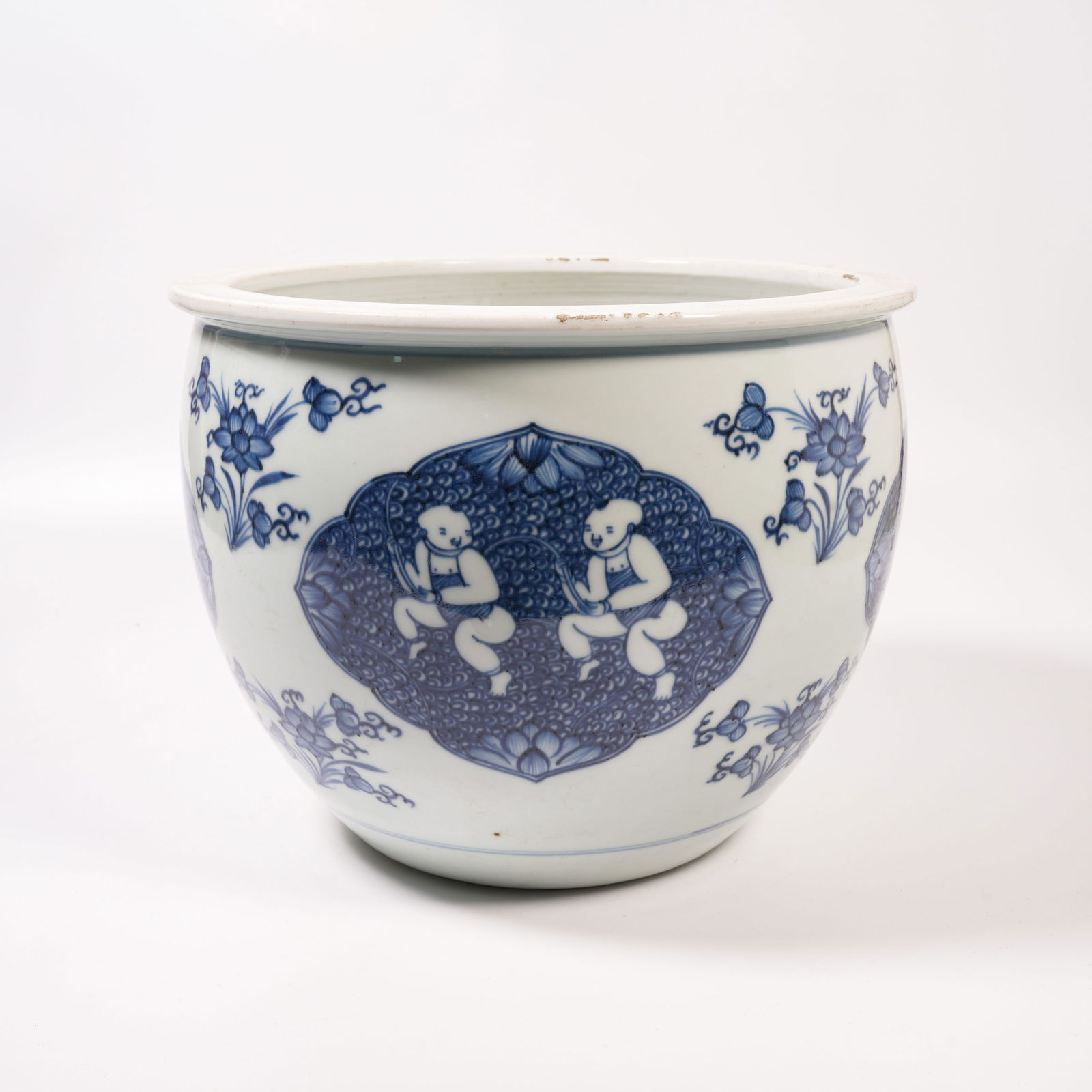 A BLUE-AND-WHITE JAR WITH LOTUS-HOLDING CHILD DESIGN: Blue-and-White Jar with Lotus-Holding Child Design