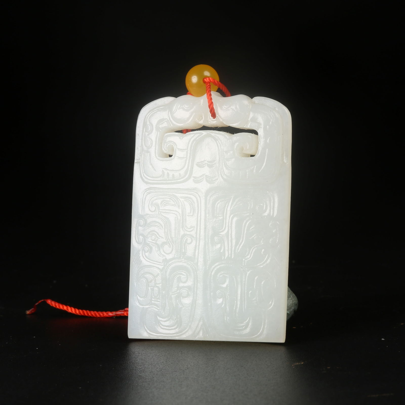 A HETIAN JADE PLAQUE WITH ANIMAL-MASK MOTIF: Hetian Jade Plaque with Animal-Mask Motif