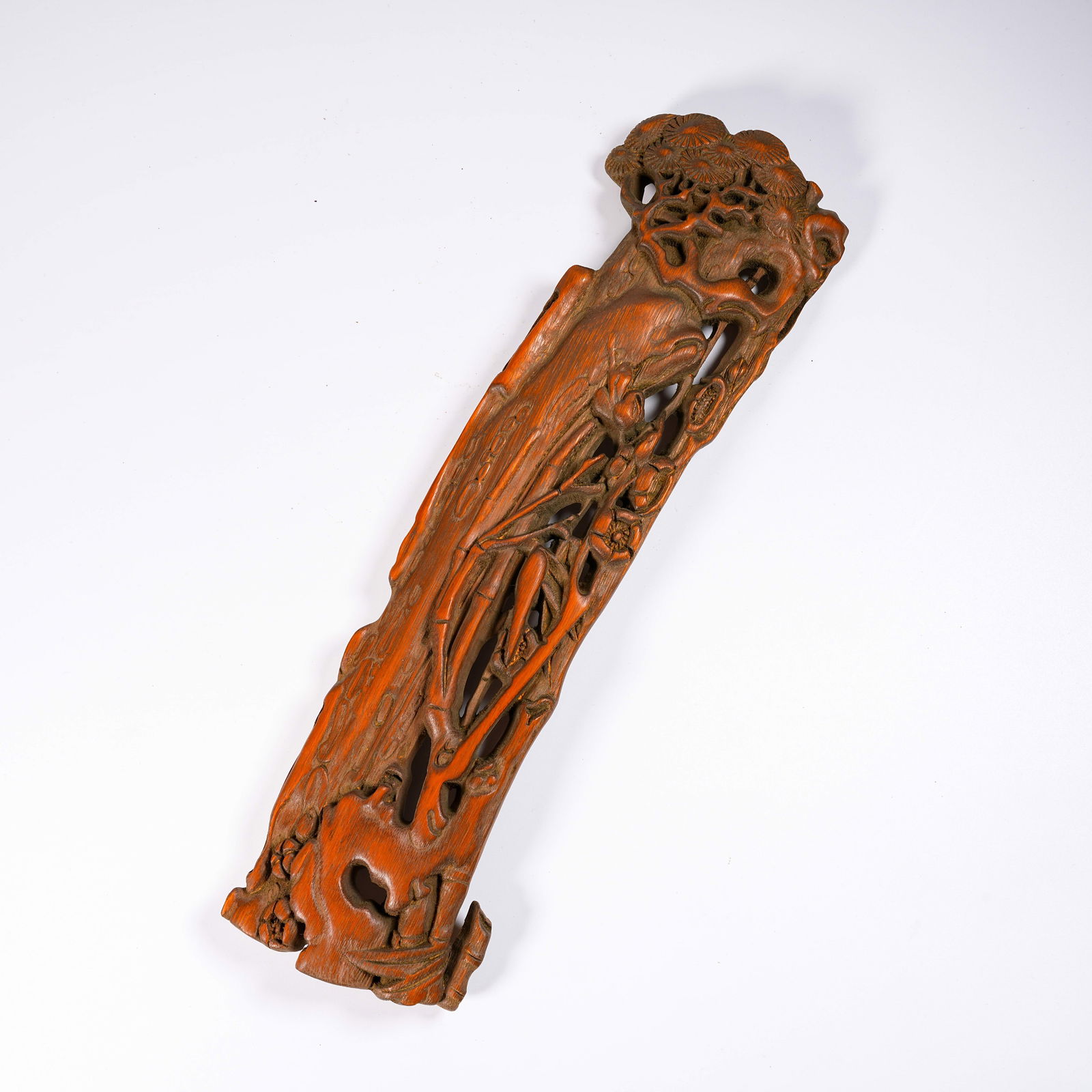 A BAMBOO CARVED FLORAL-PATTERN ARMREST: Bamboo Carved Floral-Pattern Armrest