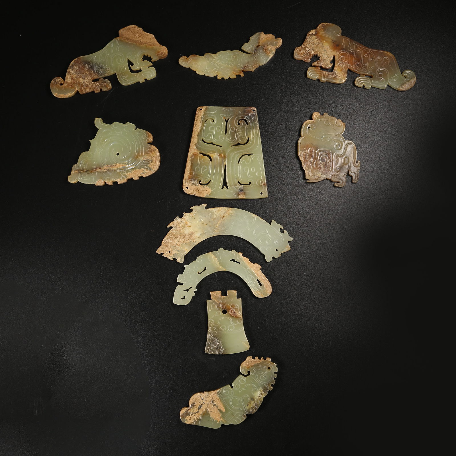 A ANCIENT JADE AUSPICIOUS BEAST PENDANT SET: Ancient Jade Auspicious Beast Pendant Set