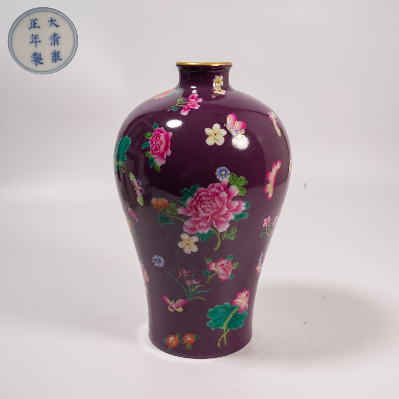 A EGGPLANT-PURPLE GROUND FAMILLE-ROSE MEIPING WITH FLOWER-AND-BUTTERFLY DESIGN: Eggplant-Purple Ground Famille-Rose Meiping with Flower-and-Butterfly Design