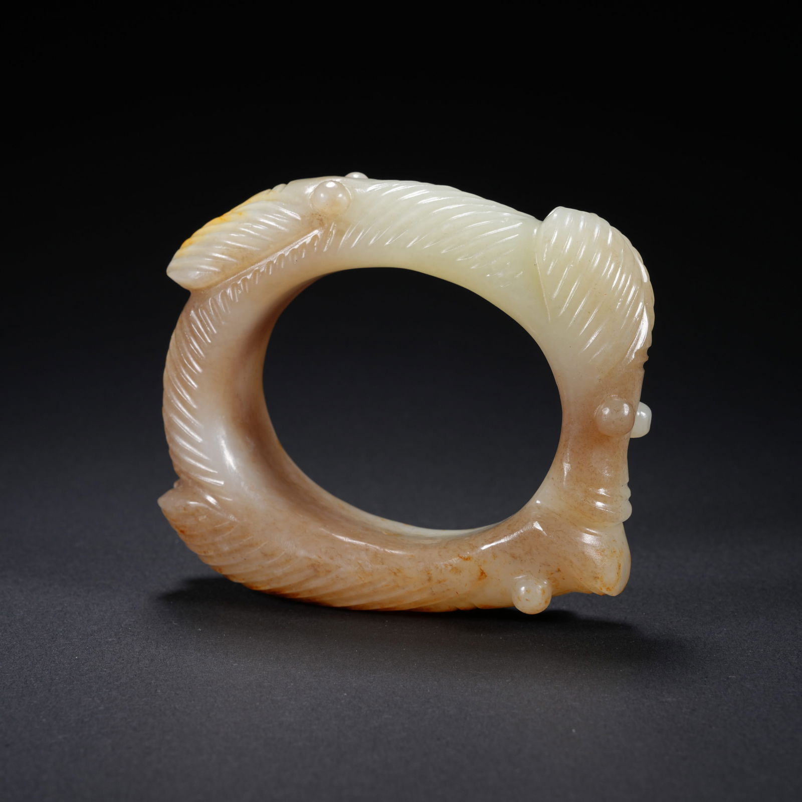 A HETIAN JADE CARVED CICADA-MOTIF BANGLE: Hetian Jade Carved Cicada-Motif Bangle